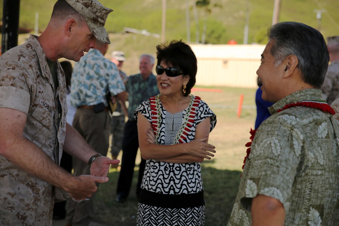 Commanding Officer of Marine Corps Base Hawaii Col. Eric Schaefer speaks with State of Hawaii Governor David Ige and his wife, Hawaii First Lady Dawn Ige at Kaneohe Bay Range Training Facility March 16, 2015. Ige was invited by U.S. Marine Corps Forces, Pacific Commander Lt. Gen. John A. Toolan to tour Marine Corps Base Hawaii and be briefed on how the installation supports MARFORPAC's operational forces based in Hawaii and transiting the Pacific on deployment throughout the Asia Pacific region.  Ige was also briefed on how MCBH supports the base Marines and sailors and their families, along with the local community.  His visit was also an opportunity to discuss future growth ideas for MCB Hawaii geared at supporting MARFORPAC's operational forces. (U.S.  Marine Corps photo by Sgt. Sarah Dietz)
