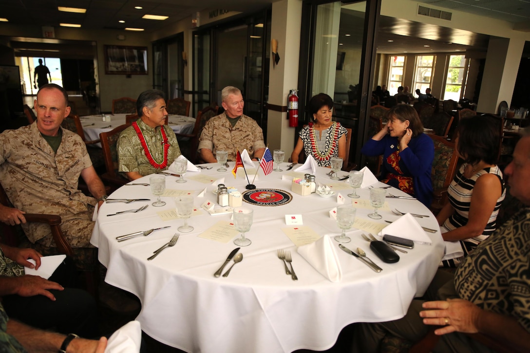 From left, Commanding Officer of Marine Corps Base Hawaii Col. Eric Schaefer, State of Hawaii Governor David Ige, U.S. Marine Corps Forces, Pacific Commander Lt. Gen. John A. Toolan, Hawaii First Lady Dawn Ige, Helen Toolan and Ms. Schaefer sit together at the Officer’s Club on Marine Corps Base Hawaii before lunch March 16, 2015. Ige was invited by U.S. Marine Corps Forces, Pacific Commander Lt. Gen. John A. Toolan to tour Marine Corps Base Hawaii and be briefed on how the installation supports MARFORPAC's operational forces based in Hawaii and transiting the Pacific on deployment throughout the Asia Pacific region.  Ige was also briefed on how MCBH supports the base Marines and sailors and their families, along with the local community.  His visit was also an opportunity to discuss future growth ideas for MCB Hawaii geared at supporting MARFORPAC's operational forces. (U.S.  Marine Corps photo by Sgt. Sarah Dietz)
