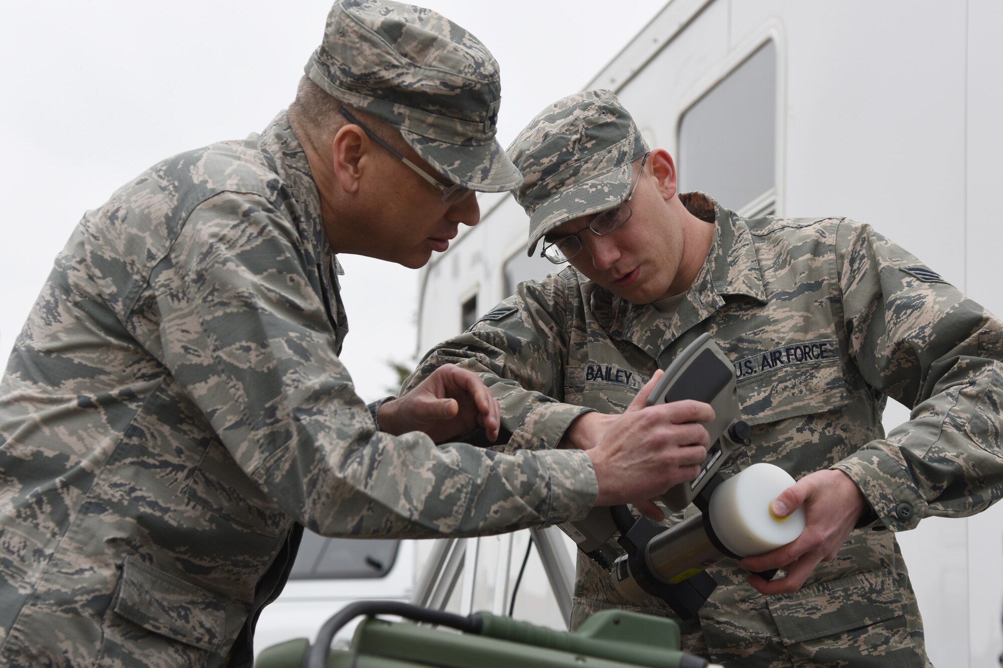 Maj. Gen. Jack Weinstein, Task Force 214 and 20th Air Force commander, listens to Senior Airman Jonathan Bailey, 341st Medical Operations Squadron bioenvironmental engineering technician, as he describes a radiation detection device during a recent visit to Malmstrom Air Force Base, Mont., March 11, 2015. (U.S. Air Force photo/Tech. Sgt. Chad Thompson)