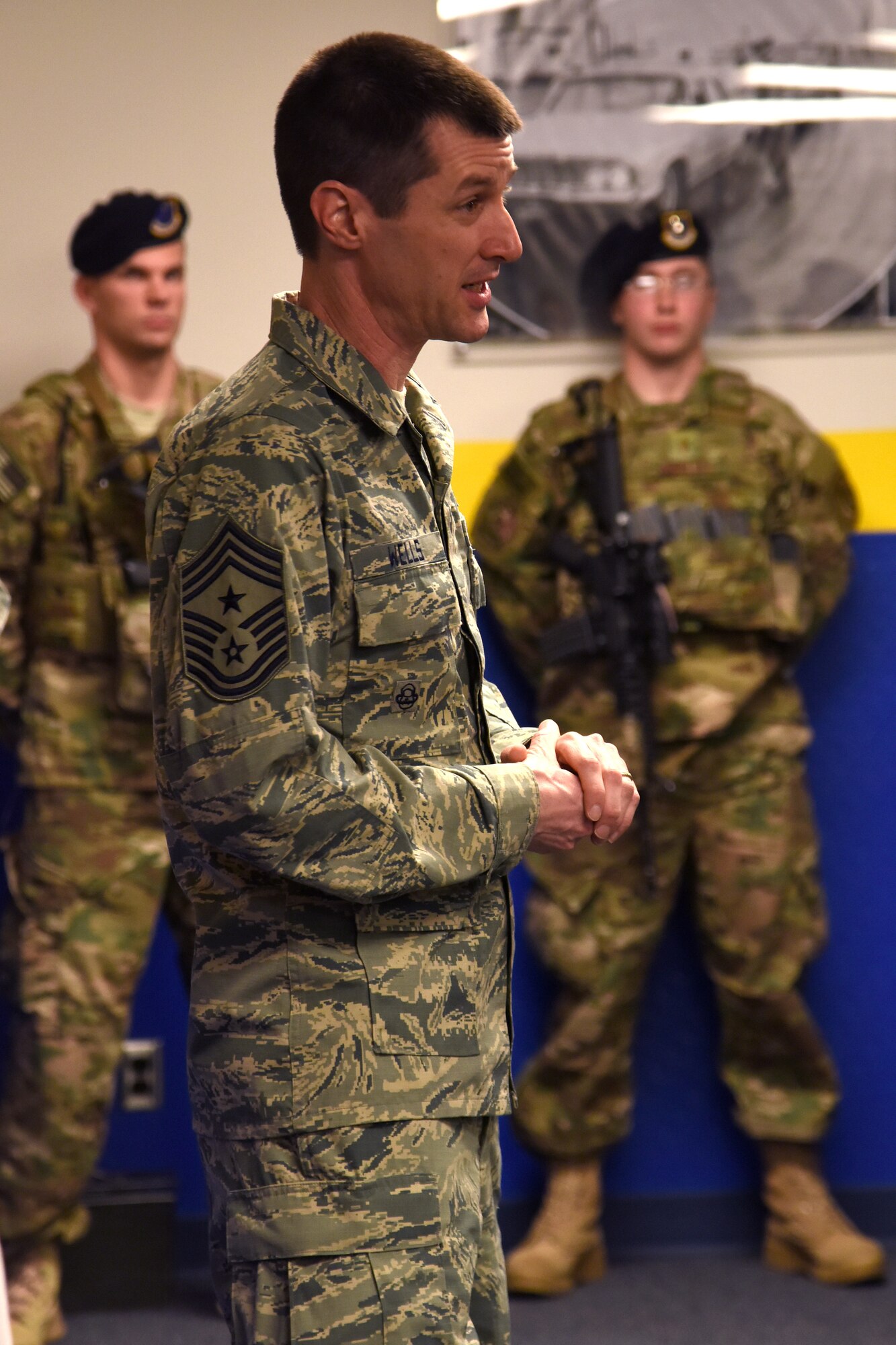 Chief Master Sgt. Matthew Wells, Task Force 214 and 20th Air Force command chief, visits Airmen of the 341st Security Forces Group March 12, 2015, at Malmstrom Air Force Base, Mont.  Wells visited the base to tour its facilities , discuss the Task Force 214 and Twentieth Air Force Strategic Narrative with Airmen and meet with Airmen on base and deployed in the missile field.  (U.S. Air Force photo/Chris Willis)