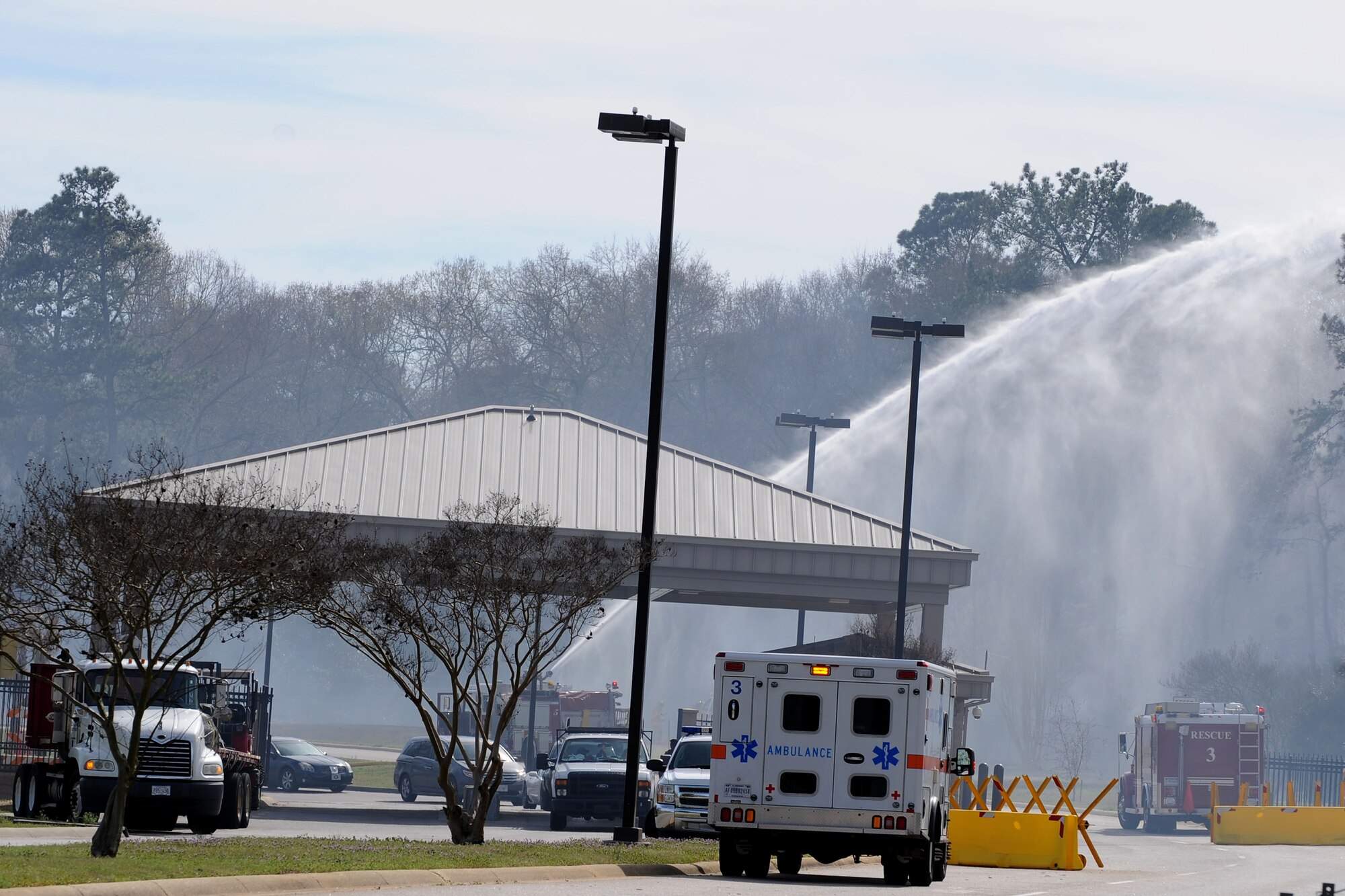U.S. Air Force Airmen assigned to the 20th Civil Engineer Squadron fire department attempt to put out a brush fire just outside of the main gate at Shaw Air Force Base, S.C., March 16, 2015. The Airmen responded to assist the Sumter County Fire Department with the suppression of the fire. (U.S. Air Force photo by Airman 1st Class Michael Cossaboom/Released) 