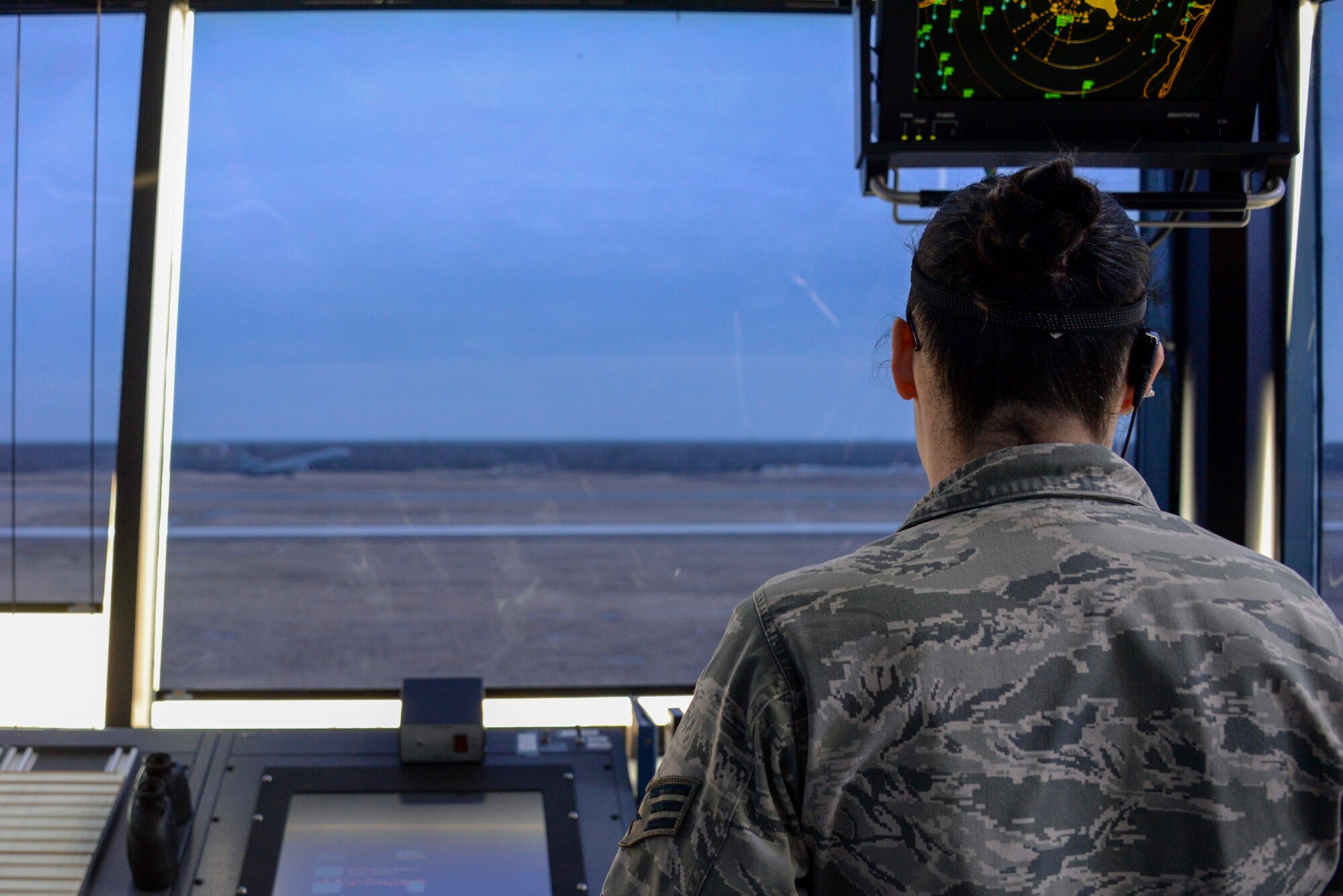 Senior Airman Katlyn Herndon, 305th Operations Support Squadron air traffic controller, communicates with a KC-10 Extender refueling aircraft during takeoff at Joint Base McGuire-Dix-Lakehurst, N.J., March 11, 2015. Controllers must maintain contact with ground control personnel to stay updated on environmental conditions that might affect aircraft. (U.S. Air Force photo by Airman 1st Class Tara A. Williamson/Released)