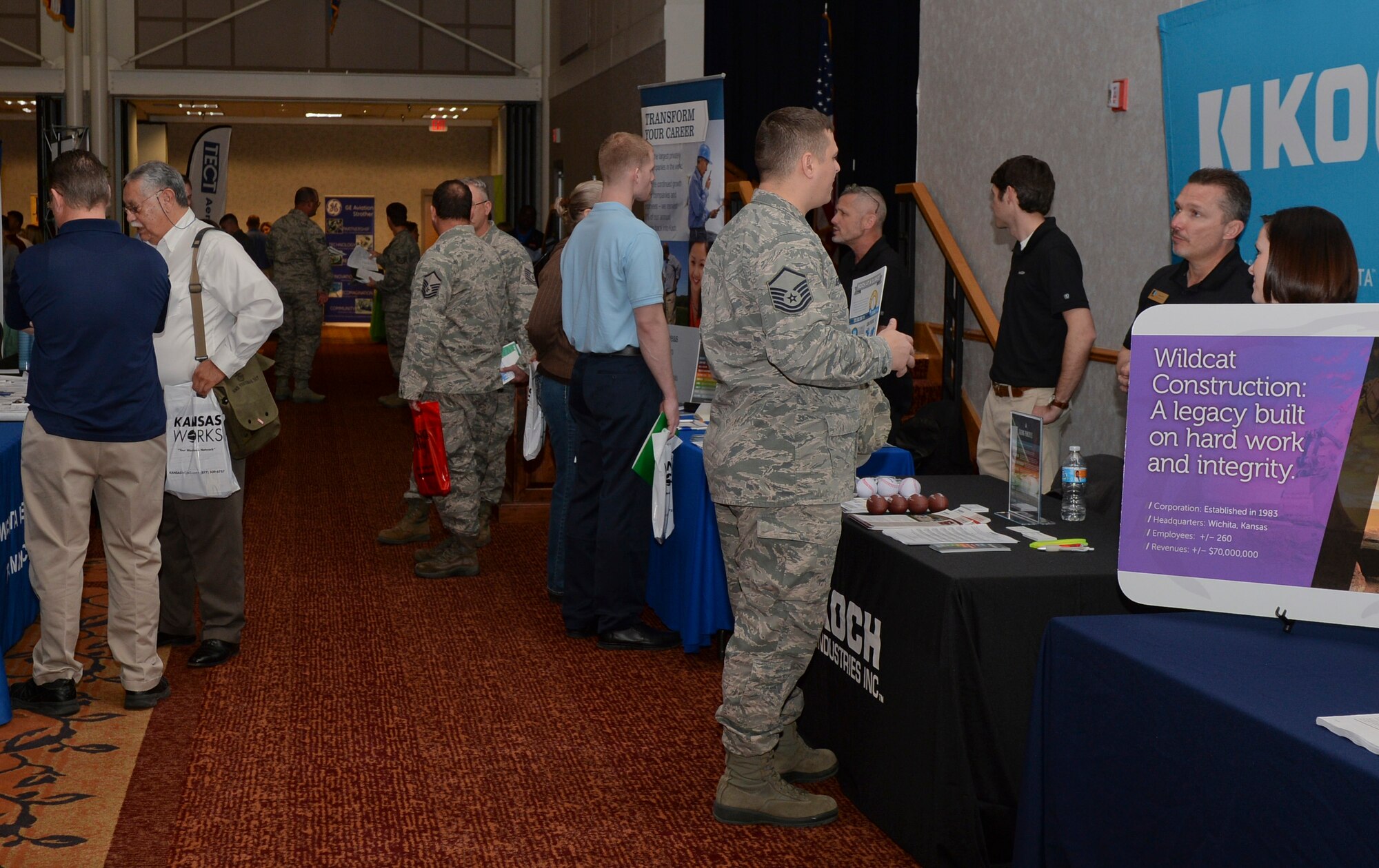 Members of Team McConnell attend a job fair March 11, 2015, at McConnell Air Force Base, Kan. The Airman and Family Readiness Center holds a job fair annually to help transitioning Airmen, veterans and dependents with their job search. (U.S. Air Force photo by Senior Airman Colby L. Hardin)