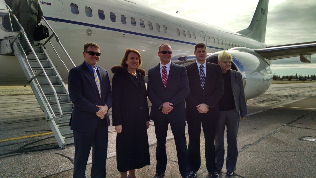 On Feb. 18, 2015, Secretary of the Air Force The Honorable Deborah Lee James visited the 90th Missile Wing, F.E. Warren AFB, Wyo., to address the base populace on the effectiveness of the nuclear enterprise Force Improvement Program. Shown here with Secretary James are members of a Protective Service Detail. From left to right is Special Agent Bryce Stringer, Secretary James, SA Tyler Wahls, SA Zachary Gigeous and SA Tonya Stott. The Protective Service Operation also included members from other federal and local law-enforcement agencies. U.S. Air Force photo by Special Agent Shannon Bancroft, commander, OSI Detachment 805. 