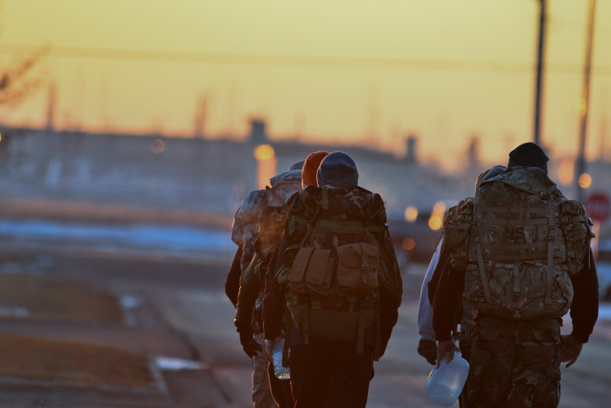Airmen from the 91st Missile Security Forces Squadron train for the Bataan Memorial Death arch on Minot Air Force Base, N.D., Feb. 2, 2015. The Bataan Memorial Death March honors a special group of World War II heroes. These brave soldiers were responsible for the defense of the islands of Luzon, Corregidor and the harbor defense forts of the Philippines. (U.S. Air Force photo/Senior Airman Brittany Y. Bateman)