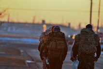 Airmen from the 91st Missile Security Forces Squadron train for the Bataan Memorial Death arch on Minot Air Force Base, N.D., Feb. 2, 2015. The Bataan Memorial Death March honors a special group of World War II heroes. These brave soldiers were responsible for the defense of the islands of Luzon, Corregidor and the harbor defense forts of the Philippines. (U.S. Air Force photo/Senior Airman Brittany Y. Bateman)
