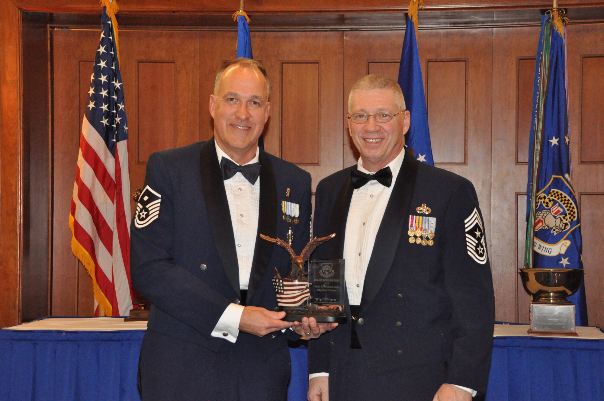 Master Sgt. David Brown, 459th Aerospace Medicine Squadron, wins the Charles R. Woodward First Sergeant Award for Excellence at the 459 ARW Annual Awards Banquet on Saturday, March 7, 2015. He was presented the award by the wing command chief, Chief Master Sgt. Tim Huffman. (Air Force Photo / SrA Kristin Kurtz)
