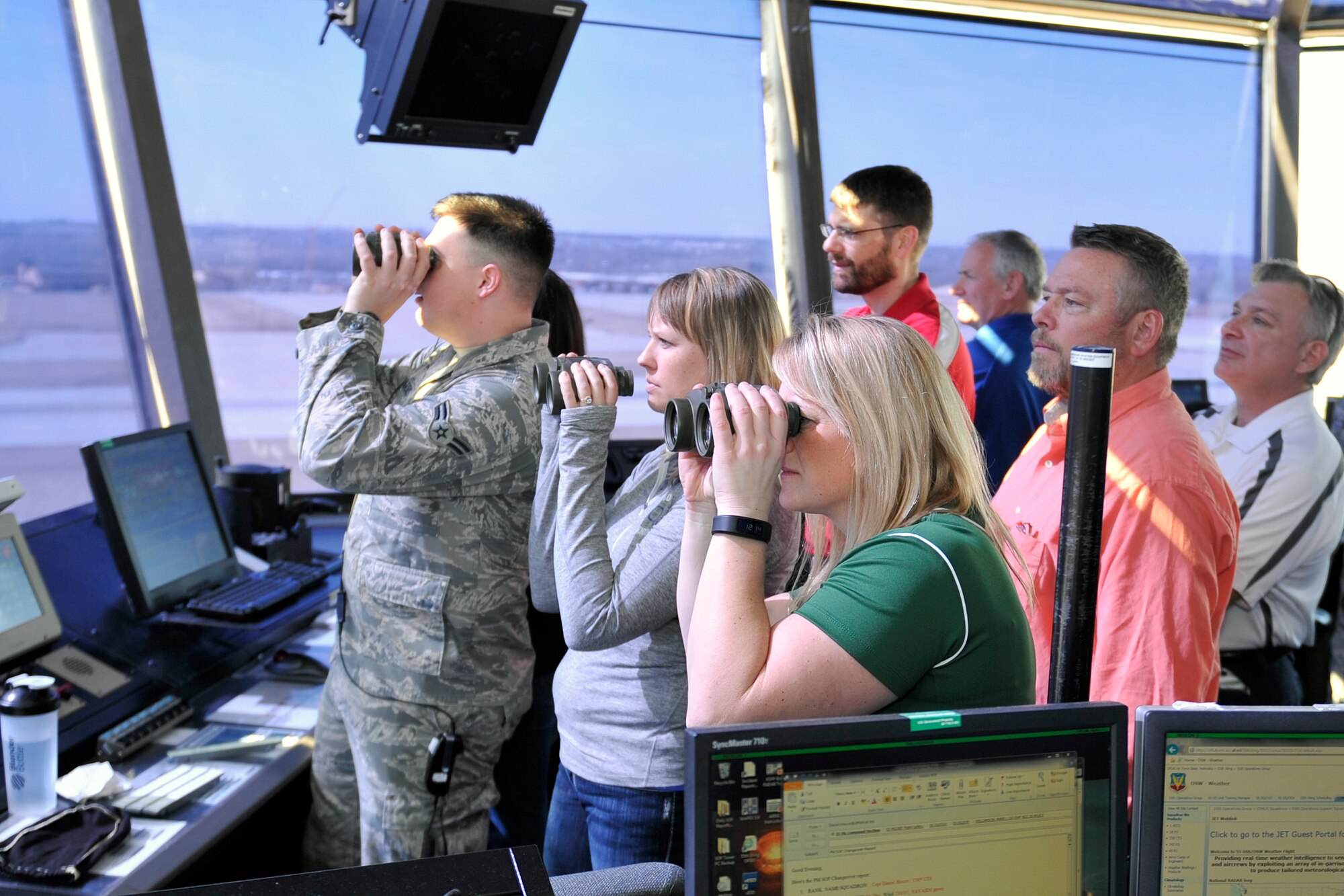 Several educators from around the region get an up-close look at the flight line from the air traffic control flight tower March 13 at Offutt Air Force Base, Neb. The 343rd Recruiting Squadron hosted the educators for a base tour as part of an effort to demystify military life. (U.S. Air Force photo by Jeff W. Gates/Released)