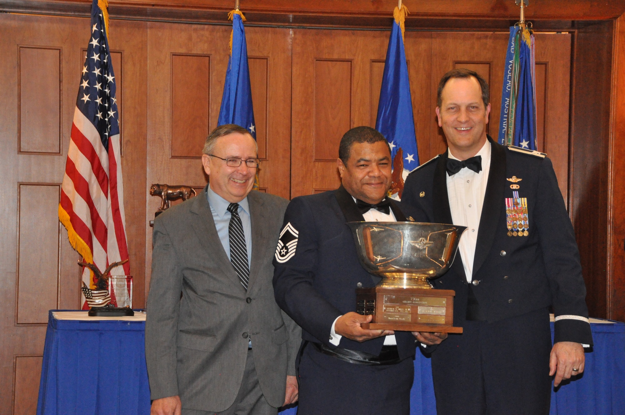 Senior Master Sgt. WIlliam Gray, 756th Air Refueling Squadron, wins the 459th Wing Association's Paul R. Julian, Jr., Award for Excellence in Aviation at the 459 ARW Annual Awards Banquet on Saturday, March 7, 2015. He is flanked by association president, Mr. Tim McConnell, and his commander, Col. Michael Moeding, 459 Operations Group. (Air Force Photo / SrA Kristin Kurtz)
