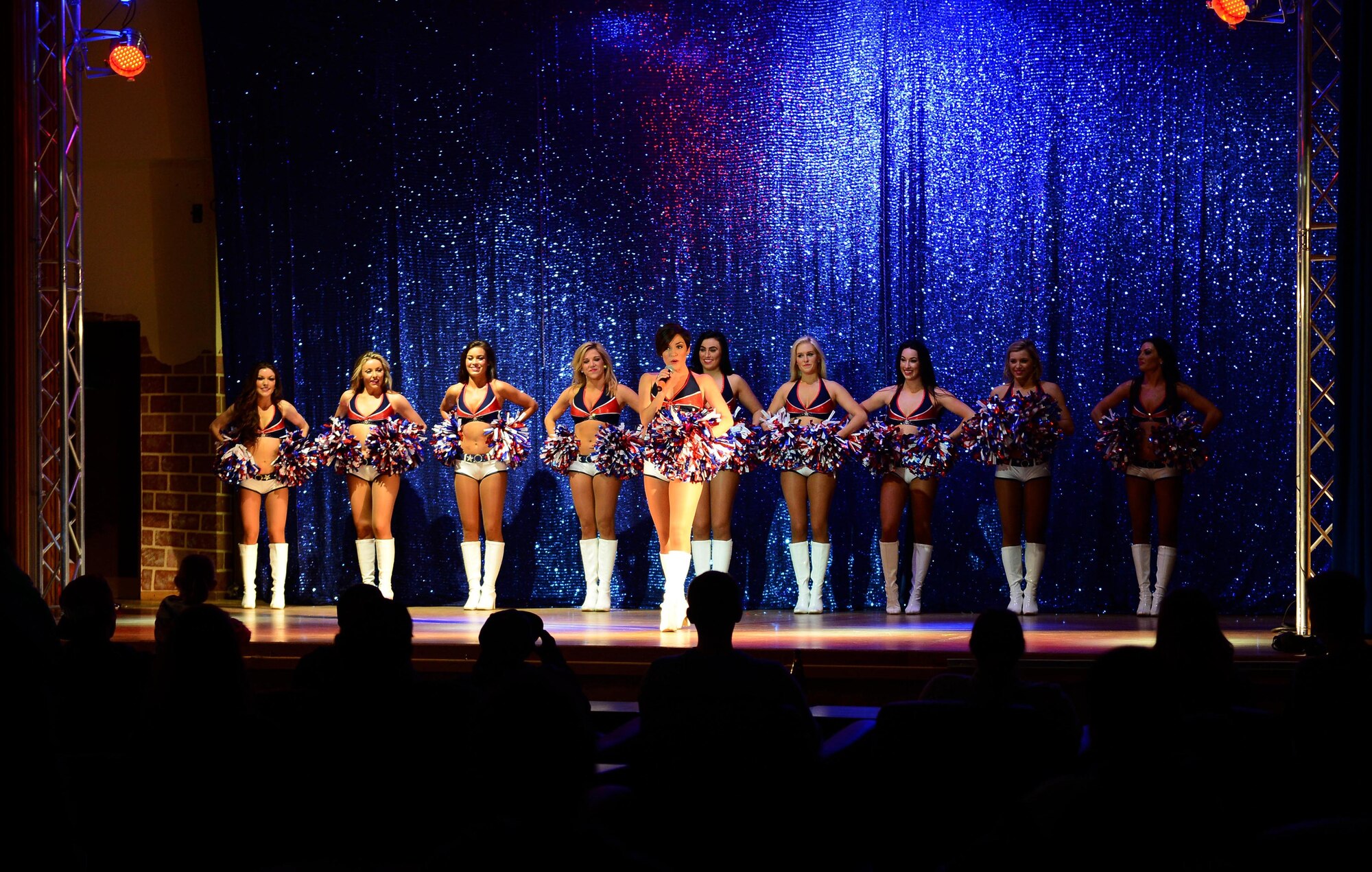 Members of the Sea Gals Show Group, made up of cheerleaders for the Seattle Seahawks, introduce themselves before their last dance routine at the Brick House on Spangdahlem Air Base, Germany, March 14, 2015. The group changed into eight different uniforms during their show. (U.S. Air Force photo by Airman 1st Class Luke Kitterman/Released)
