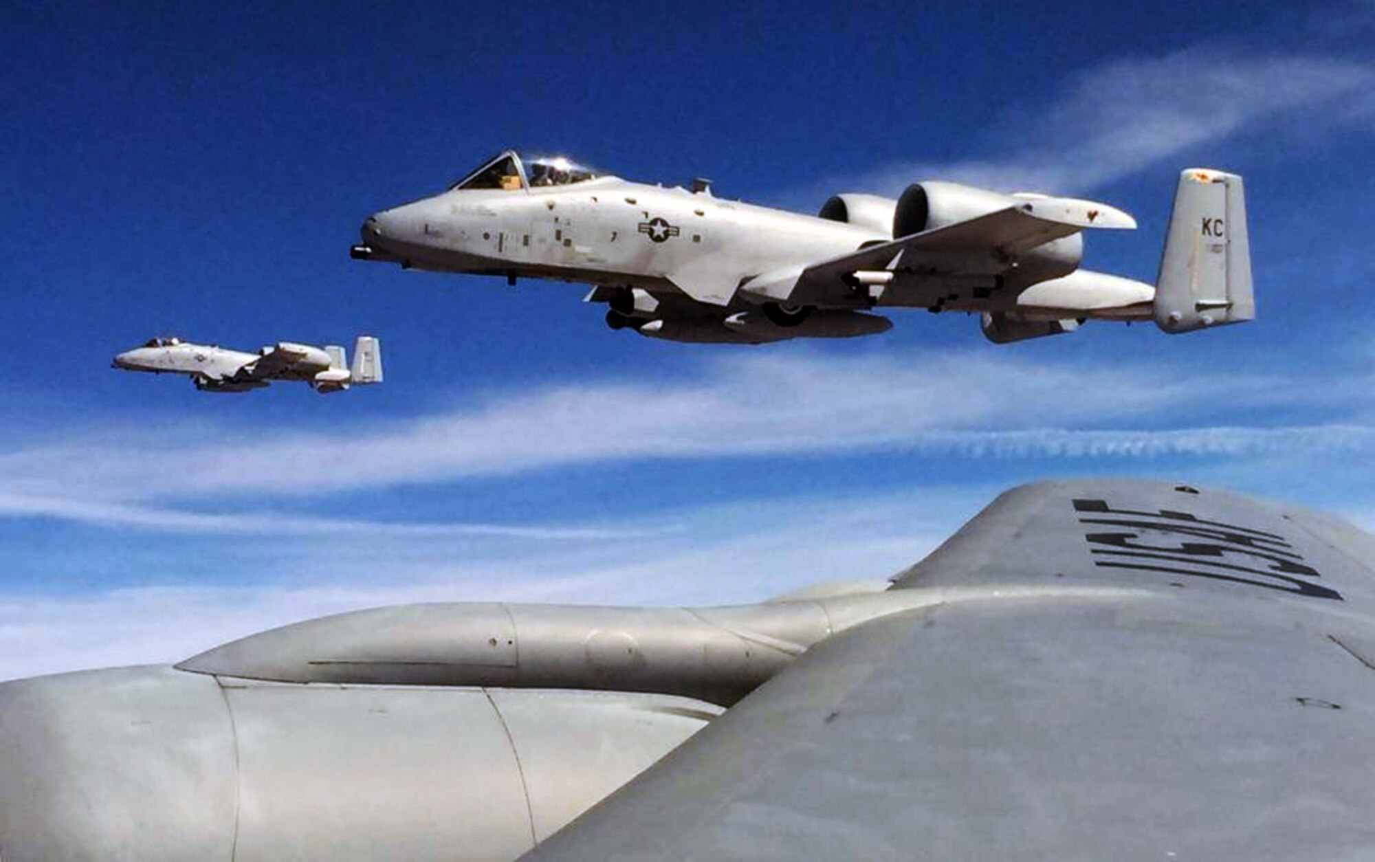 A pair of A-10 Thunderbolt II aircraft assigned to the Air Force Reserve’s 442nd Fighter Wing, Whiteman Air Force Base, Mo., flies off the wing of a KC-135 Stratotanker assigned to McConnell Air Force Base, Kan., March 13, 2015.  The KC-135 was operated by an aircrew made up of Reservists from the 931st Air Refueling Group at McConnell.  The two Reserve units were conducting an air refueling exercise to maintain air refueling currency and proficiency.  (U.S. Air Force photos by Senior Master Sgt. Ray Lewis)