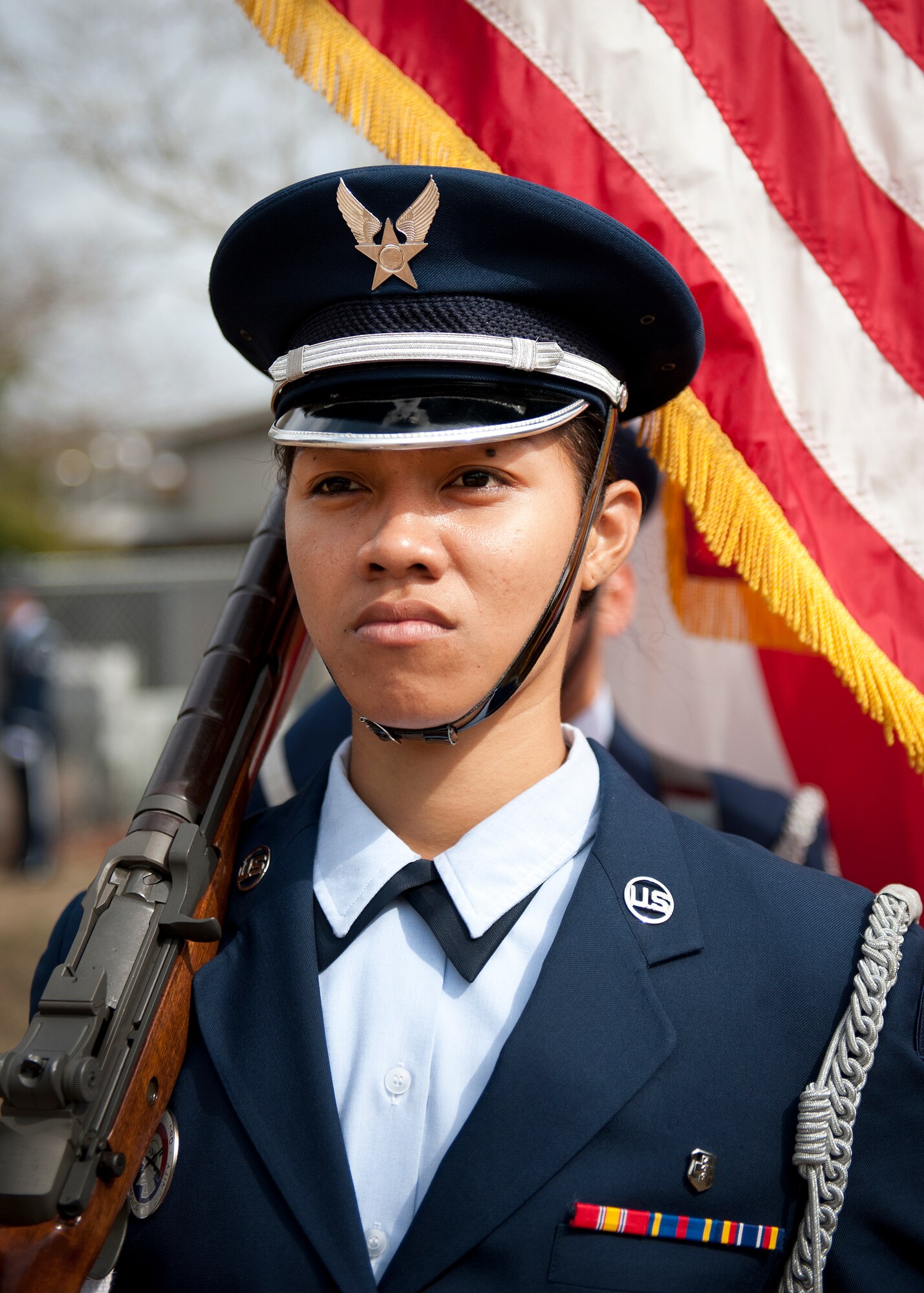 Senior Airman Hope Poialii, 96th Medical Services Squadron, leads the flag detail at the Honor Guard graduation ceremony March 4 at Eglin Air Force Base, Fla. Approximately 12 new Airmen graduated from the 80-plus-hour course. The graduation performance includes flag detail, rifle volley, pall bearers and bugler for friends, family and unit commanders. (U.S. Air Force photo/Samuel King Jr.)
