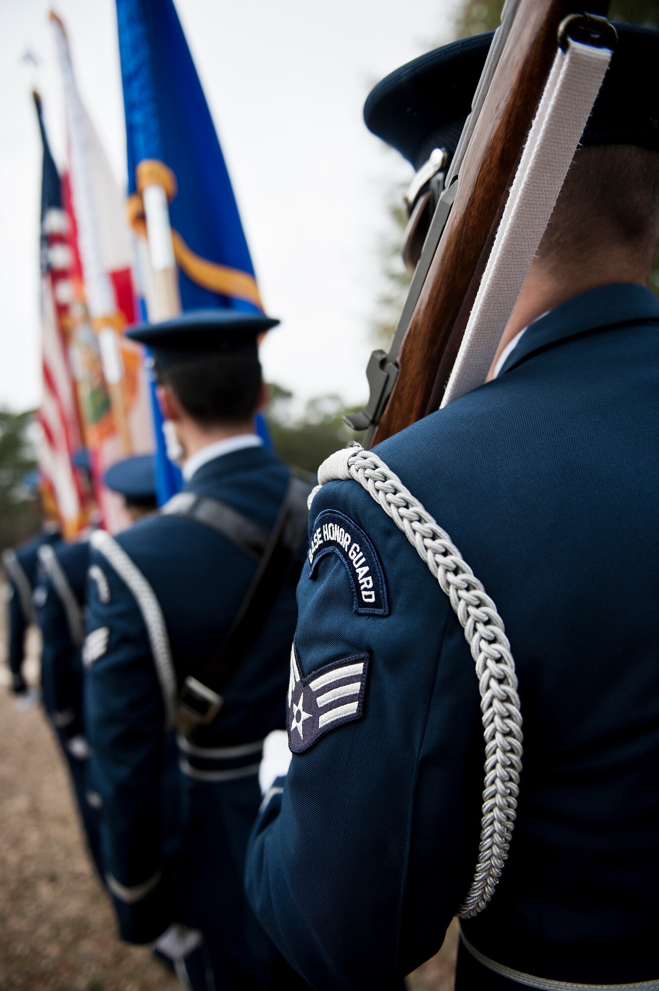 The Eglin Air Force Base Honor Guard flag detail begins to march toward the graduation ceremony March 4. Approximately 12 new Airmen graduated from the 80-plus-hour course. The graduation performance is a full military honors funeral to include flag detail, rifle volley, pall bearers and bugler. (U.S. Air Force photo/Samuel King Jr.)