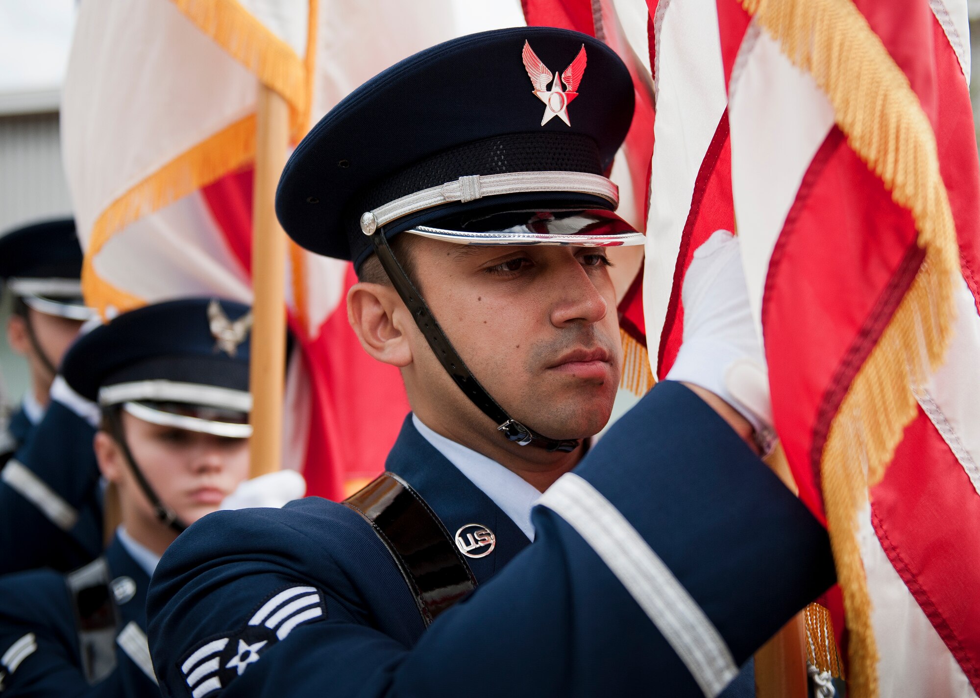 Senior Airman Mario Pozo, 33rd Operations Support Squadron, carries the American flag during an Honor Guard graduation ceremony March 4 at Eglin Air Force Base, Fla. Approximately 12 new Airmen graduated from the 80-plus-hour course. The graduation performance includes flag detail, rifle volley, pall bearers and bugler for friends, family and unit commanders. (U.S. Air Force photo/Samuel King Jr.)