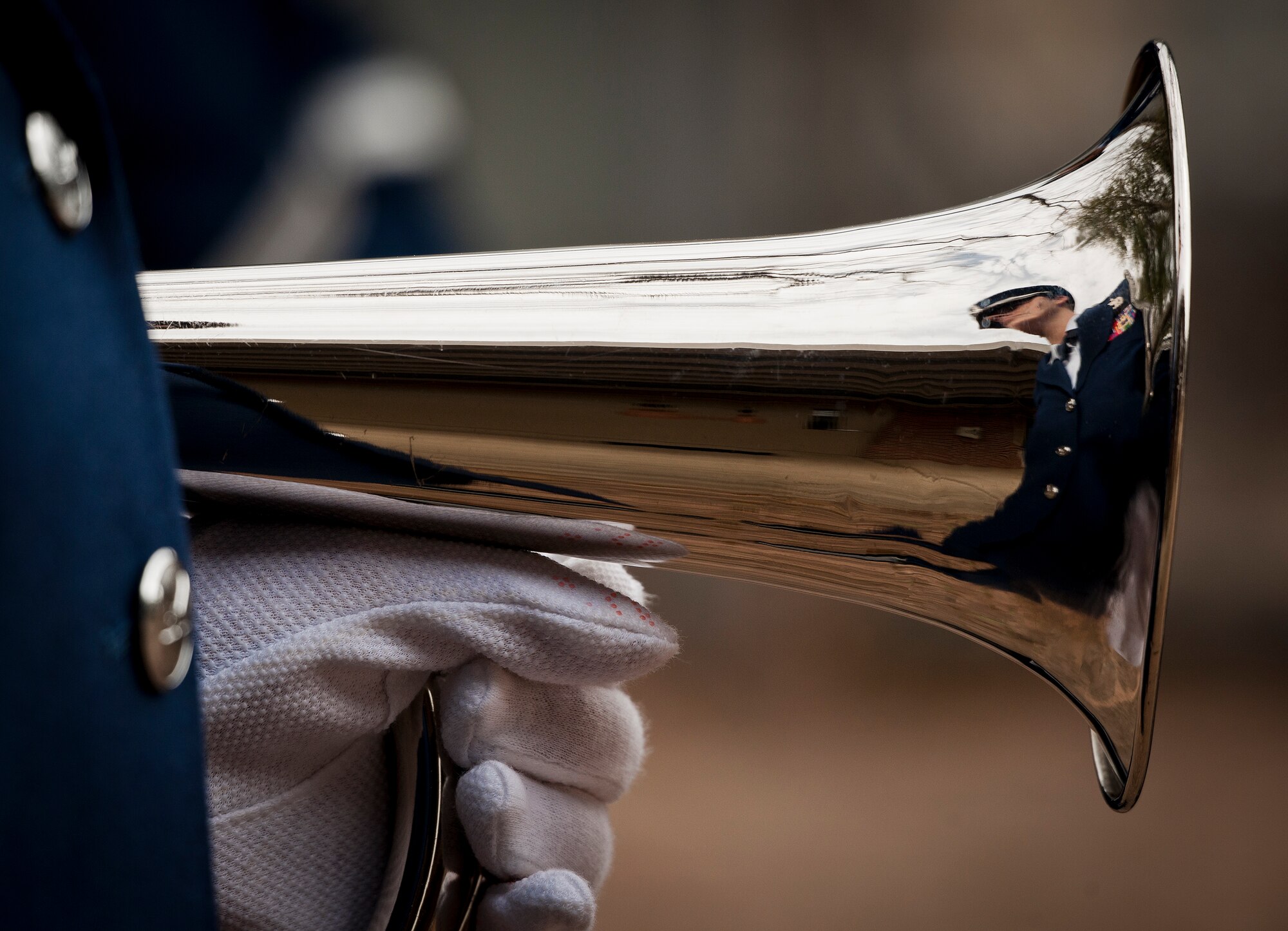 Staff Sgt. Jessica Scharmen, 96th Logistics Readiness Squadron, holds the bugle prior to the Honor Guard graduation ceremony March 4 at Eglin Air Force Base, Fla. Approximately 12 new Airmen graduated from the 80-plus-hour course. The graduation performance is a full military honors funeral to include flag detail, rifle volley, pall bearers and bugler. (U.S. Air Force photo/Samuel King Jr.)
