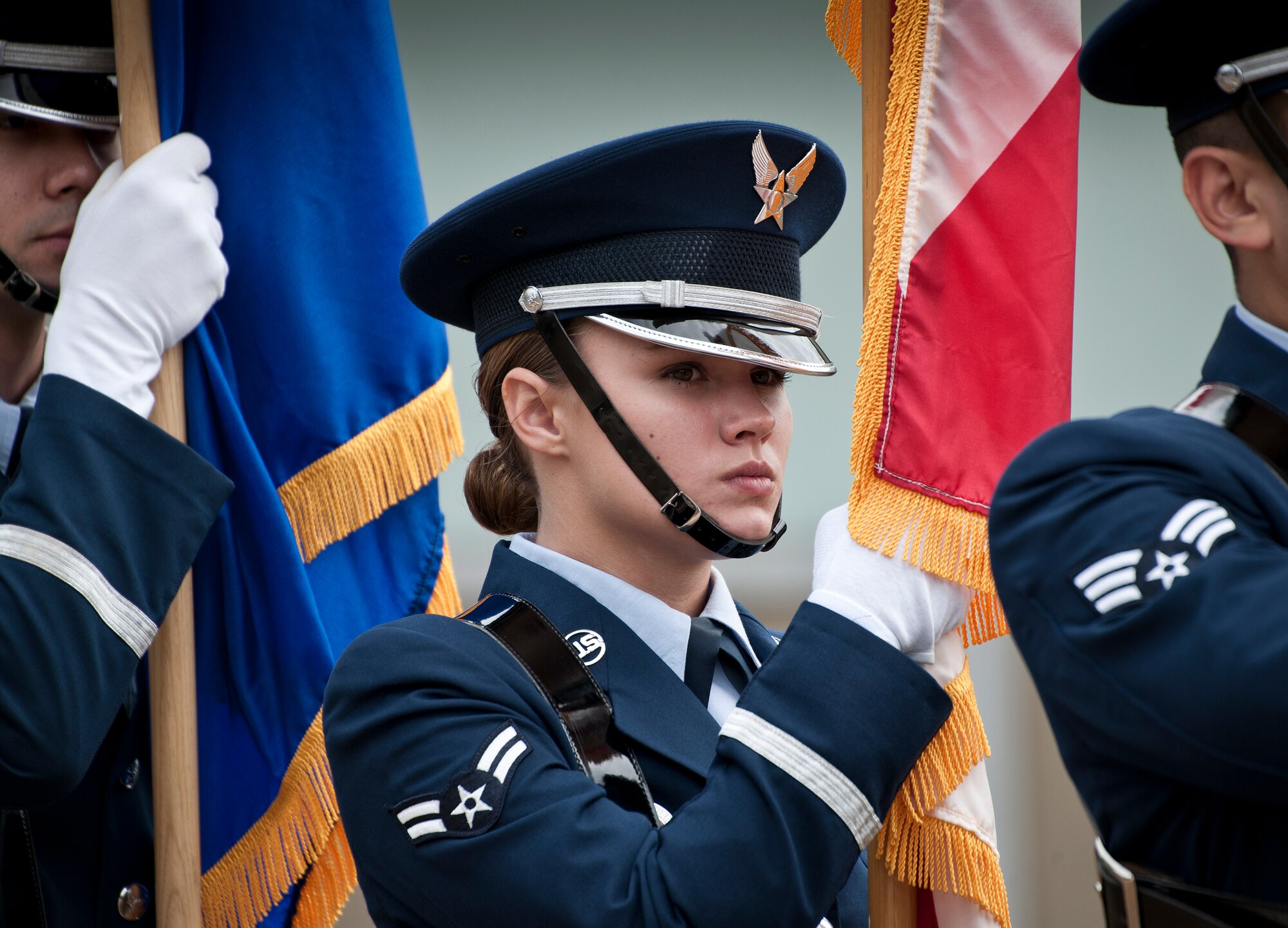 Airman 1st Class Natalie Beers, 96th Force Support Squadron, carries the state flag of Florida during an Honor Guard graduation ceremony March 4 at Eglin Air Force Base, Fla. Approximately 12 new Airmen graduated from the 80-plus-hour course. The graduation performance includes flag detail, rifle volley, pall bearers and bugler for friends, family and unit commanders. (U.S. Air Force photo/Samuel King Jr.)