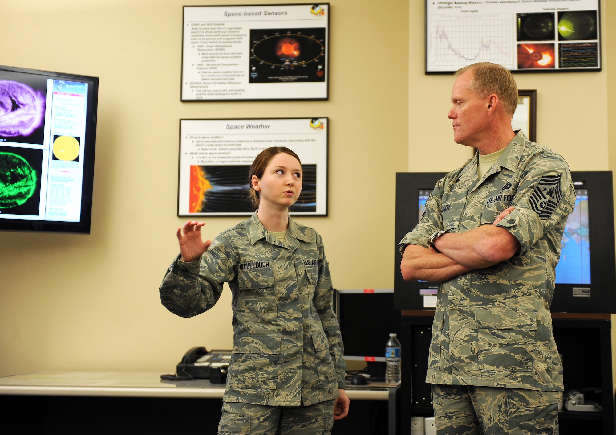 U.S. Air Force Senior Airman Robyn McCullough, 2d Weather Squadron, briefs Chief Master Sgt. of the Air Force James Cody on the role of solar weather in the Air Force March 11 at the Air Force Weather Agency, Offutt Air Force Base, Neb. This was Cody’s first visit to AFWA to hear about its unique mission. (U.S. Air Force photo by Josh Plueger)
