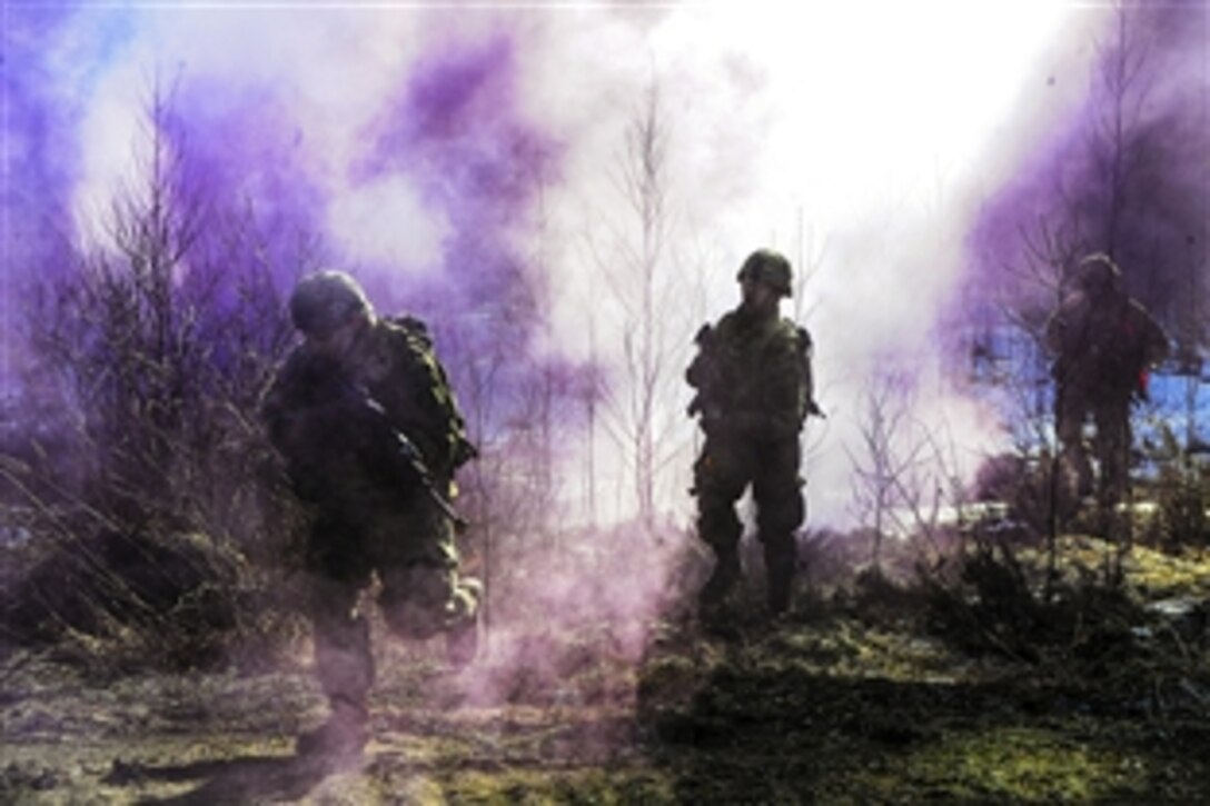 U.S. soldiers move under the cover of smoke during a combined exercise with Estonian soldiers as part of Operation Atlantic Resolve in Estonia, March, 13, 2015. The soldiers are assigned to 3rd Squadron, 2nd Cavalry Regiment.