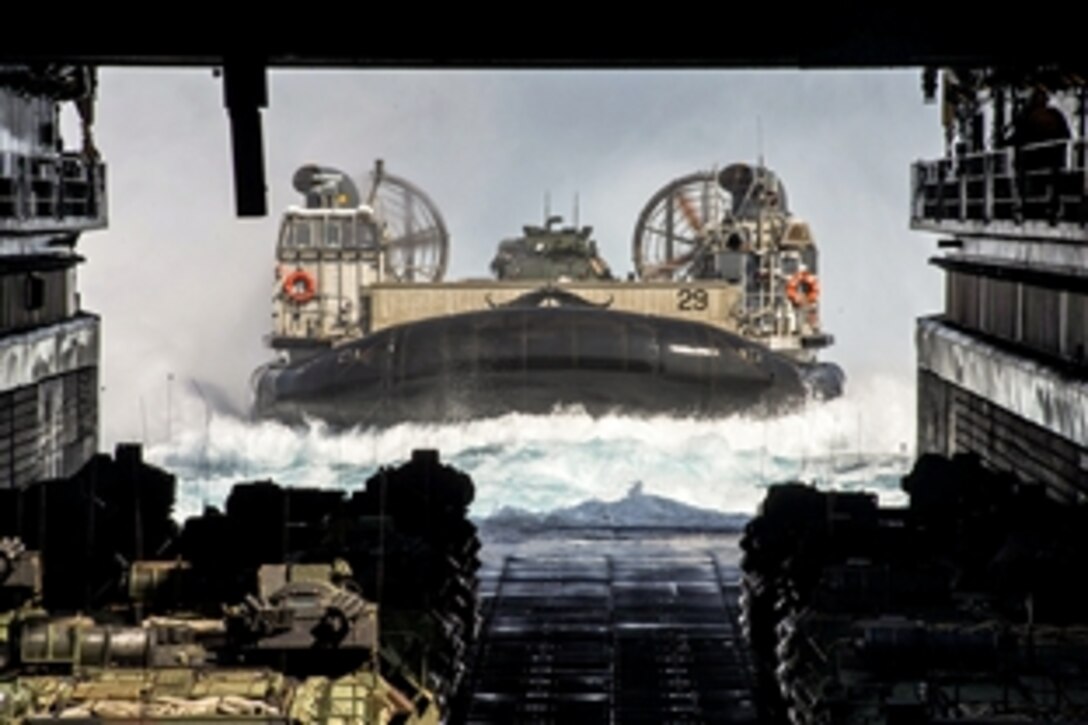 A landing craft air cushion enters the well deck of the amphibious dock landing ship USS Ashland as it conducts a certification exercise in the East China Sea, March 15, 2015. The landing craft is assigned to Naval Beach Unit 7.
