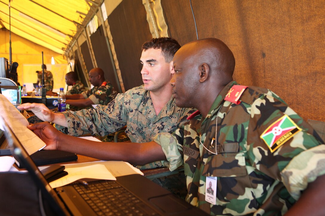 Exercise Eastern Accord demonstrates regional and international cooperation to fight violent extremism in East Africa. A Rwandan staff member coordinate actions within the scenario with his U.S. Marine Corps counterpart.In Uganda, Exercise Eastern Accord is known as Maliza Ugaidi, which means “end terrorism” in Swahili, stressing regional security between regional countries to stifle violent extremism and gender-based violence. Since 2012, Eastern Accord has been a multinational exercise conducted annually and is hosted by a different participating country each year.