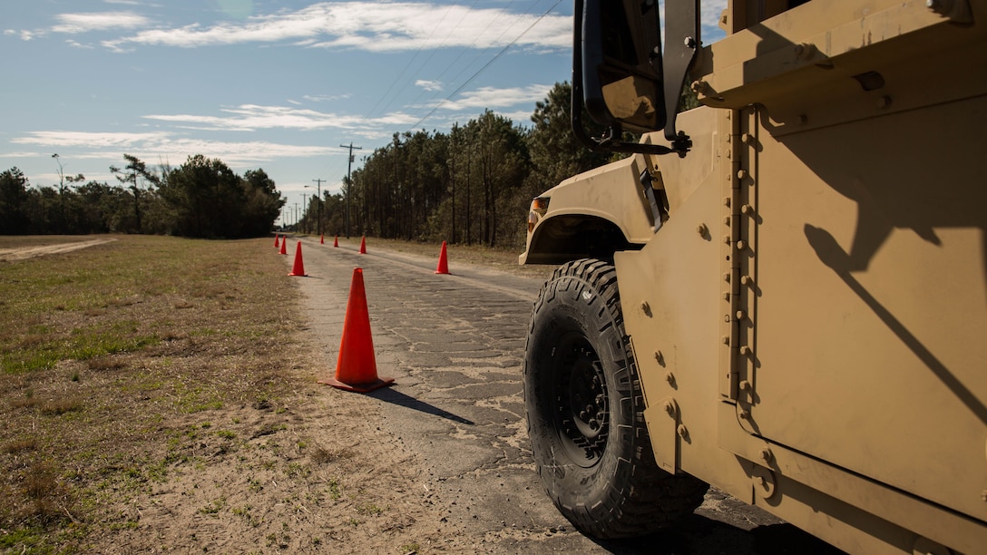 Lance Cpl. Jeremy R. Everett, an automotive maintenance technician with 8th Communication Battalion, II Marine Expeditionary Force, practices driving a Humvee to gain his operator’s license during 8th Comm.’s field exercise aboard Camp Lejeune, N.C., March 12, 2015.  During the Humvee licensing course, motor transportation Marines participated in a class followed by a practice course and a set amount of miles driven on the road. 