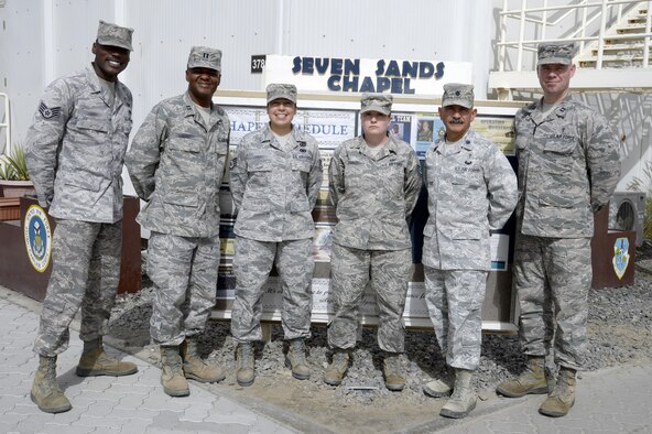 The Seven Sands Chapel staff stands for a photo at an undisclosed location in Southwest Asia Mar. 11, 2015. The wing chapel staff is here to perform and provide decisive spiritual support today and prepare Airmen, Soldiers and civilians to execute always. (U.S. Air Force photo/Tech. Sgt. Marie Brown)