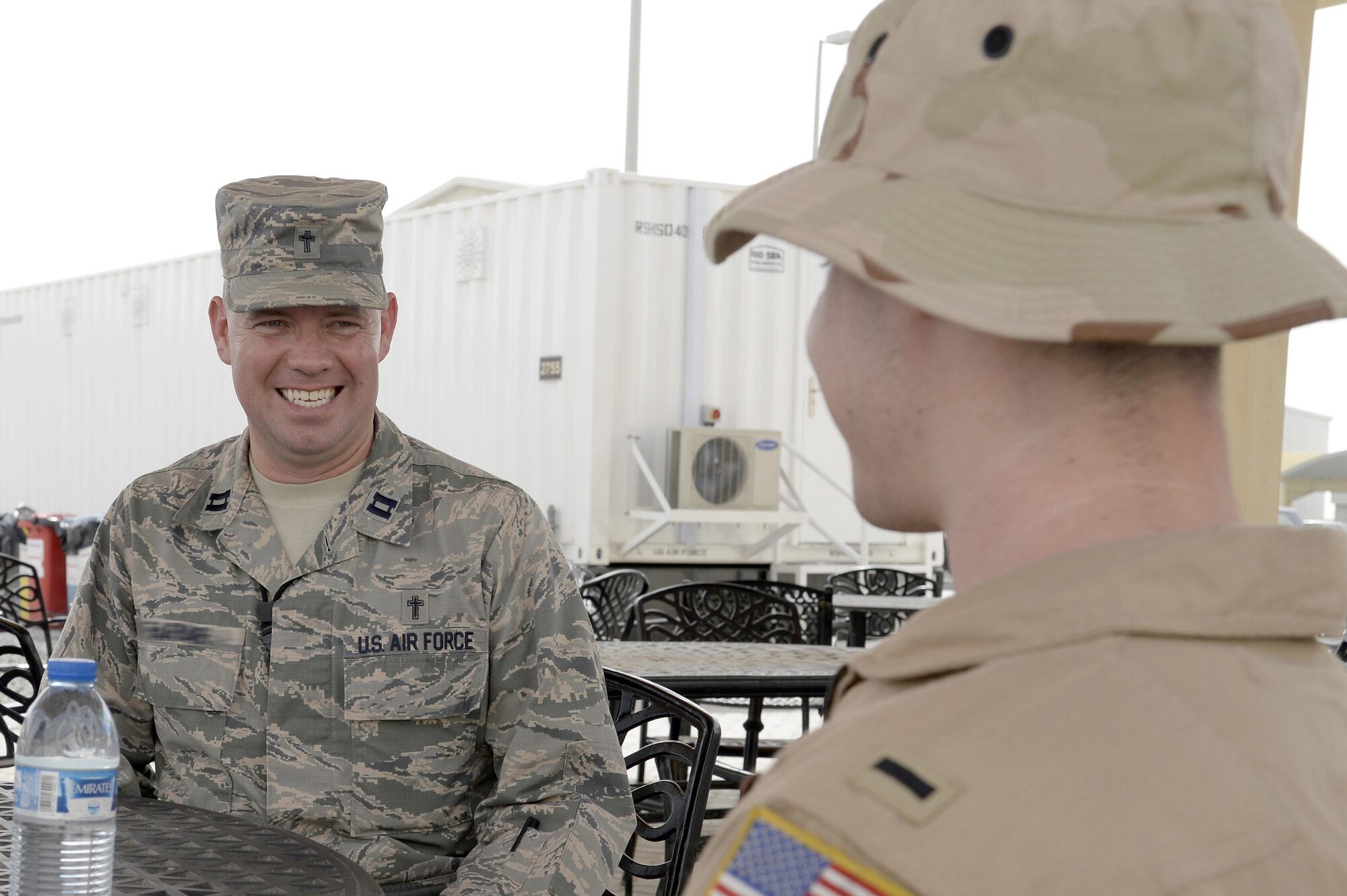 Chaplain Michael, Seven Sands Chapel, talks with an Airman at an undisclosed location in Southwest Asia Mar. 11, 2015. The chapel team is made up religious support teams that take care of the souls of the warfighter through what they call unit ministries or unit engagements. Michael is currently deployed from Offutt Air Force Base, Neb., and is a native of Yuma, Ariz. (U.S. Air Force photo/Tech. Sgt. Marie Brown)