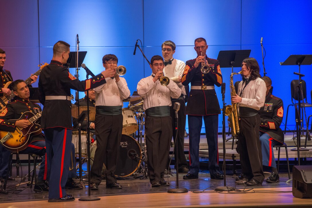 Members of the Marine Corps Jazz band play with middle school musicians during a jazz and improvisation clinic at Hammerskjold Middle School in East Brunswick, New Jersey, March 11. Students from schools around the area attended the clinic and a concert by the band afterwards.