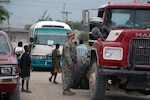 Pfc. Michael D. Hons talks to a truck operator prior to allowing the driver into the RSOI (reception, staging, onward movement and integration) site in Haiti. Hons was part of a group of 21 Soldiers with the North Dakota Army National Guard’s 191st Military Police Company who volunteered for a four-week humanitarian mission to Haiti. They provided force protection as part of U.S. Southern Command’s New Horizons program while assisting in the aftermath of the Jan. 12 earthquake there.