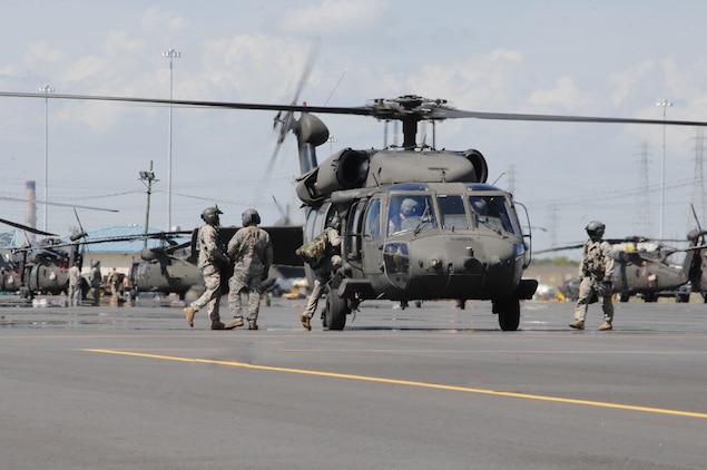 Pilots from the 101st Combat Aviation Brigade, Fort Campbell, Ky., board a Black Hawk at Blount Island Command, Jacksonville, Fla., March 10. 