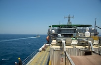 The Spanish patrol boat Infanta Elena, left, escorts the container ship MV Cape Ray through the Strait of Gibraltar en route to the Mediterranean Sea June 26, 2014. The U.S. government-owned MV Cape Ray was modified and deployed to the eastern Mediterranean Sea to dispose of Syrian chemical agents in accordance with terms Syria agreed to in late 2013. U.S. Navy photo by Mass Communication Specialist Seaman Desmond Parks