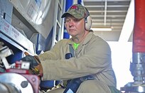 Brandon Jones turns a valve to operate a hydrolysis system aboard the U.S. ship MV Cape Ray in the Mediterranean Sea, July 14, 2014. Jones is a safety officer. U.S. Navy photo by Seaman Desmond Parks