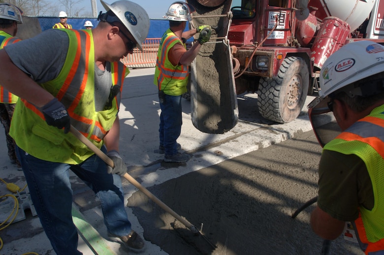 A Bauer Foundation Corporation construction crew places the last concrete March 17, 2015 into the Center Hill Dam embankment signifying the completion of the U.S. Army Corps of Engineers Nashville District’s remediation project.  The Corps of Engineers and its Contractor Bauer Foundation Corporation installed a 2.5-feet thick concrete barrier wall vertically along the embankment in overlapping rectangular columns as deep as 308 feet from the top of the dam deep into the solid-rock foundation.  The placement completes the $115 million foundation barrier wall project that began July 11, 2012. Enough concrete was placed into the embankment to build a four-foot wide sidewalk 200 miles or about the distance between Nashville and Knoxville in Tennessee.