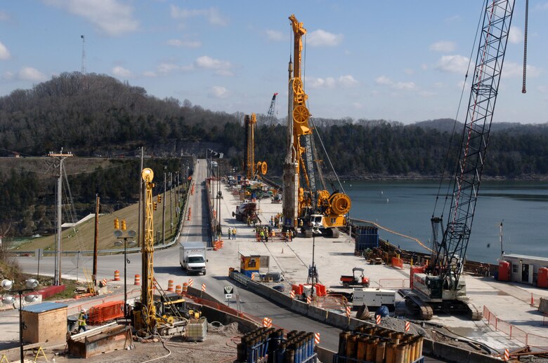 Members of the U.S. Army Corps of Engineers Nashville District and Bauer Foundation Corporation are concentrated in the center of the work ramp up March 17, 2015 to watch the last concrete placement of the Center Hill Dam Remediation Project at Lancaster, Tenn. The Corps of Engineers and its Contractor Bauer Foundation Corporation installed a 2.5-feet thick concrete barrier wall vertically along the embankment in overlapping rectangular columns as deep as 308 feet from the top of the dam deep into the solid-rock foundation.  The placement completes the $115 million foundation barrier wall project that began July 11, 2012. Enough concrete was placed into the embankment to build a four-foot wide sidewalk 200 miles or about the distance between Nashville and Knoxville in Tennessee.