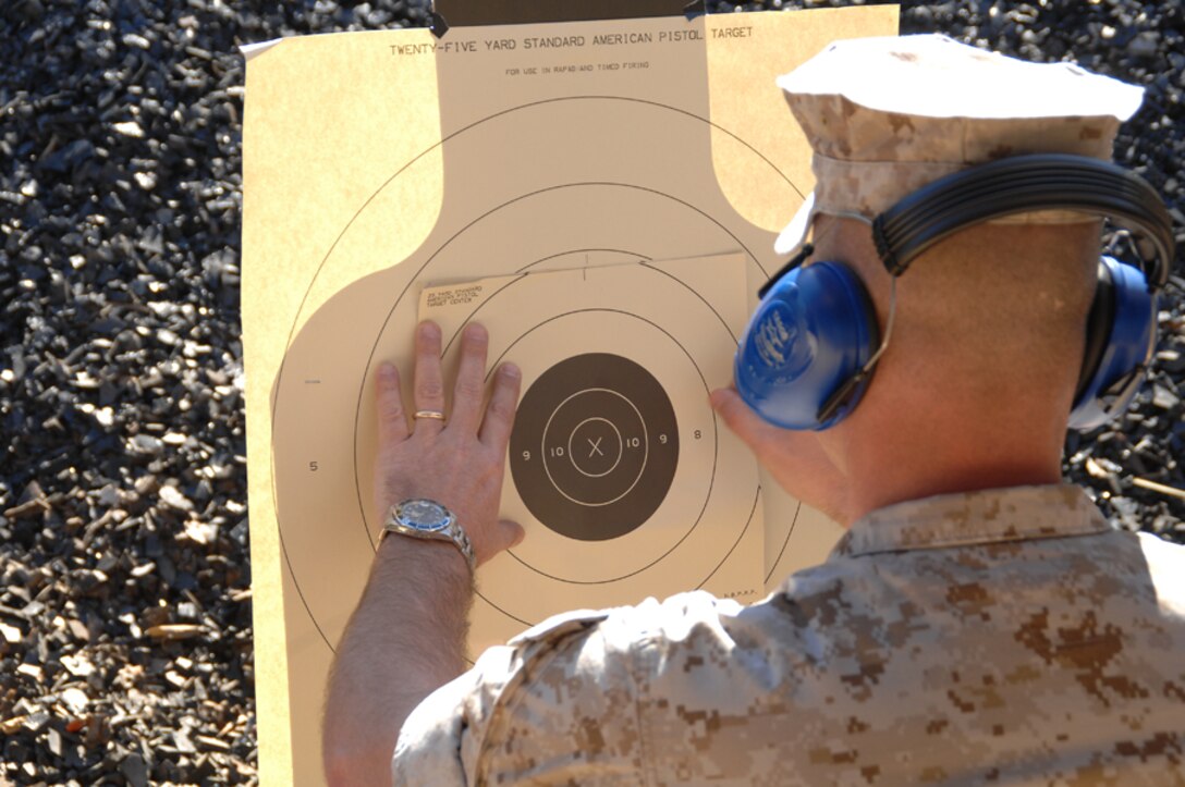 A member of the Marine Corps Logistics Base Albany Shooting Team puts up a target at the Base Pistol Range March 16 as he prepares for an upcoming pistol match at Camp Lejeune, N.C.