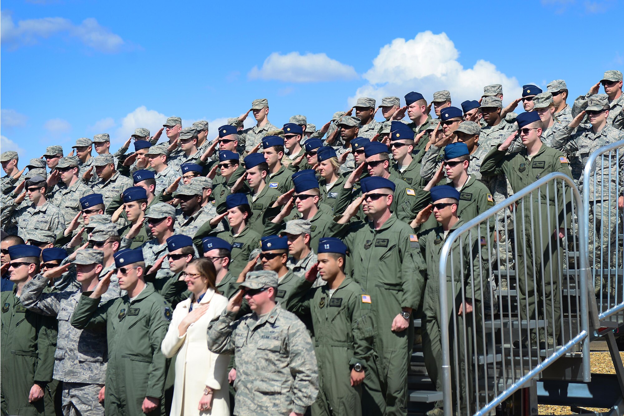Air Commandos from the 27th Special Operations Wing stand to salute the nine fallen crewmembers of Jockey 14 March 13, 2015 at Cannon Air Force Base, N.M. Cannon’s Honor Guard played Taps as guests reflected on the crew’s names, legacy and spirit. (U.S. Air Force photo/Airman 1st Class Shelby Kay-Fantozzi)