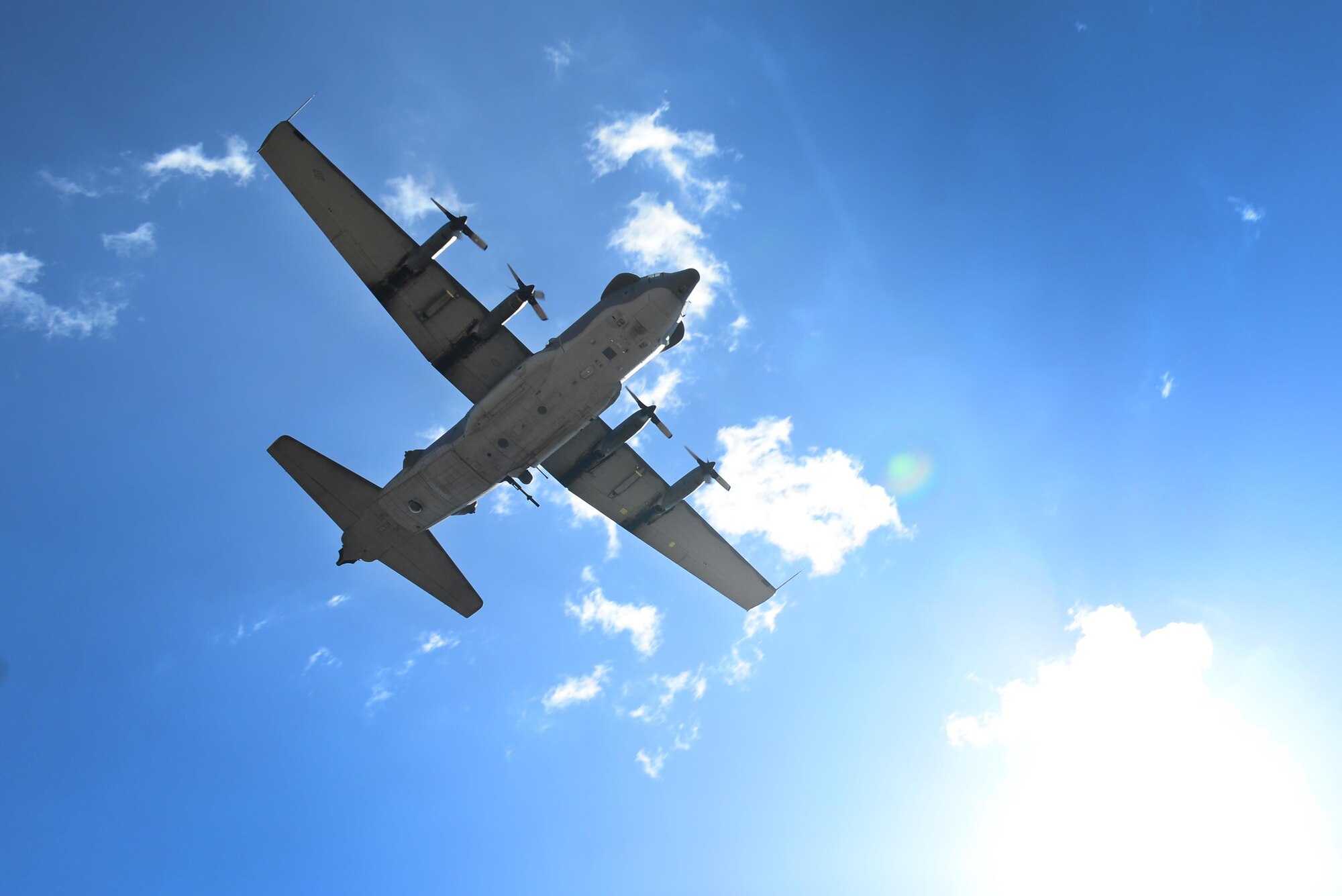 A U.S. Air Force AC-130H Spectre gunship soars over the Jockey 14 memorial March 13, 2015 at Cannon Air Force Base, N.M. The flyover by one of only two Spectres remaining at Cannon called attention both to the heritage of the AC-130H crew that perished when Jockey 14 crashed and to the venerable airframe’s pending retirement. (U.S. Air Force photo/Airman 1st Class Shelby Kay-Fantozzi)