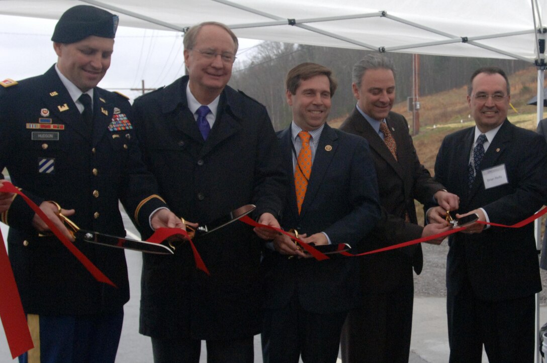 (Left to right) Lt. Col. John L. Hudson, U.S. Army Corps of Engineers Nashville District commander; Retired Air Force Lt. Gen. Frank G. Klotz, U.S. Department of Energy undersecretary for Nuclear Security and National Nuclear Security Administration administrator; Congressman Chuck Fleischmann, representing Tennessee’s 3rd District; John Eschenberg, Uranium Processing Facility federal project director; Brian Reilly, director of the Uranium Processing Facility project at the Y-12 National Security Complex in Oak Ridge, Tenn.; cut the ribbon to celebrate the Uranium Processing Facility Site Readiness Subproject at the construction site located on the Bear Creek Road Extension March 13, 2015 in Oak Ridge, Tenn.