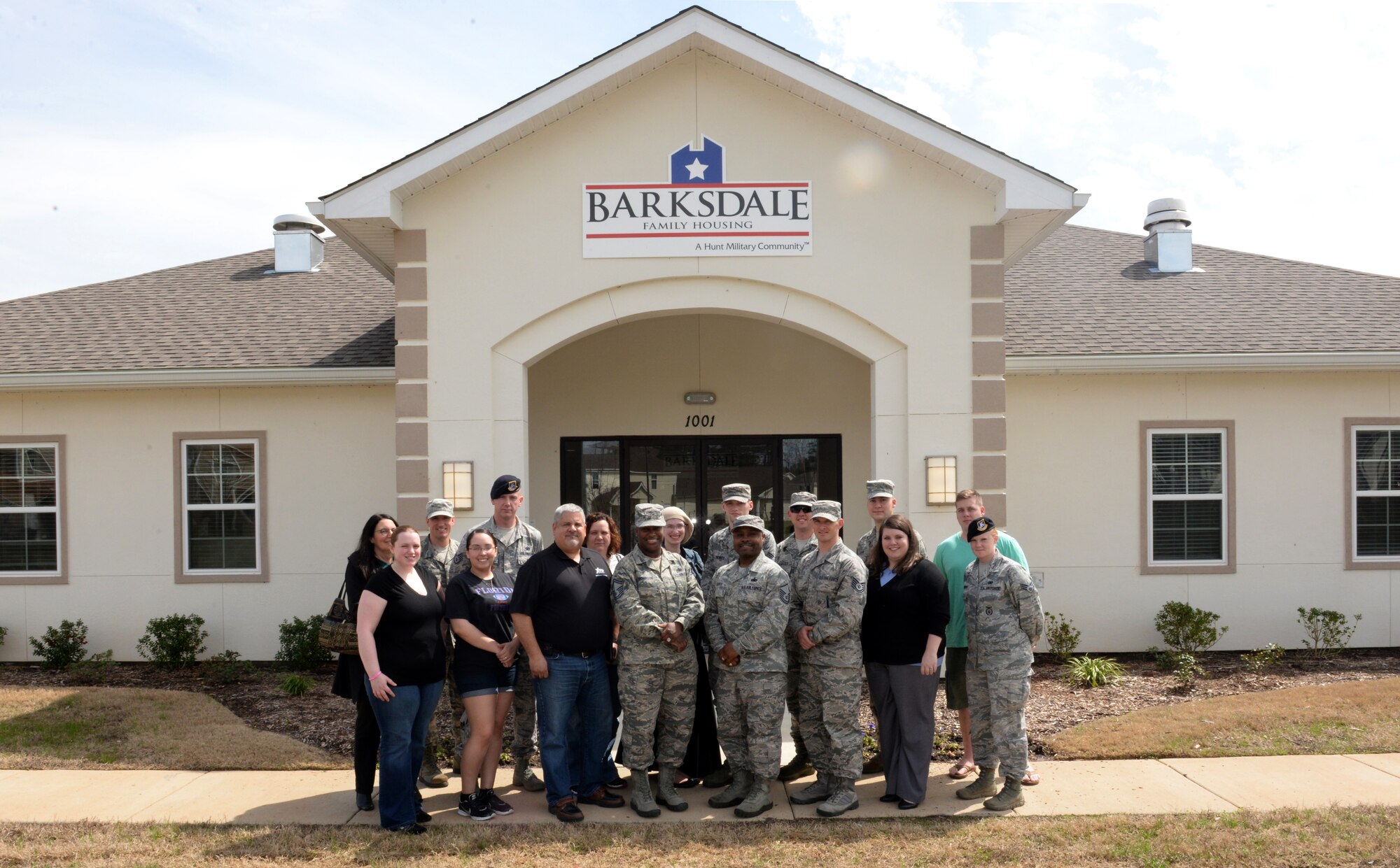 Members of Barksdale Family Housing's resident representative council pose for a photo in front of the Liberty Heights community center on Barksdale Air Force Base, La., March 17, 2015. The 33-member council will be partnering with and representing the views and opinions of 1,938 residents living in 1,091 on-base homes. (U.S. Air Force photo/Airman 1st Class Curt Beach)