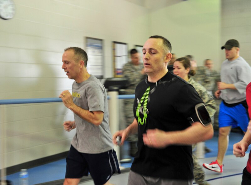 Chief Master Sgt. Thomas Stiles, 5th Medical Group chief, runs 357 laps on Minot Air Force Base, N.D., March 4, 2015. Stiles turned 42 years old that day and celebrated with an approximately 30 mile run around the base track. This is a long-time tradition for Stiles, and several medics and fellow Airmen helped celebrate this momentous occasion by running with him and providing encouragement.  (U.S. Air Force photo/Senior Airman Malia Jenkins)