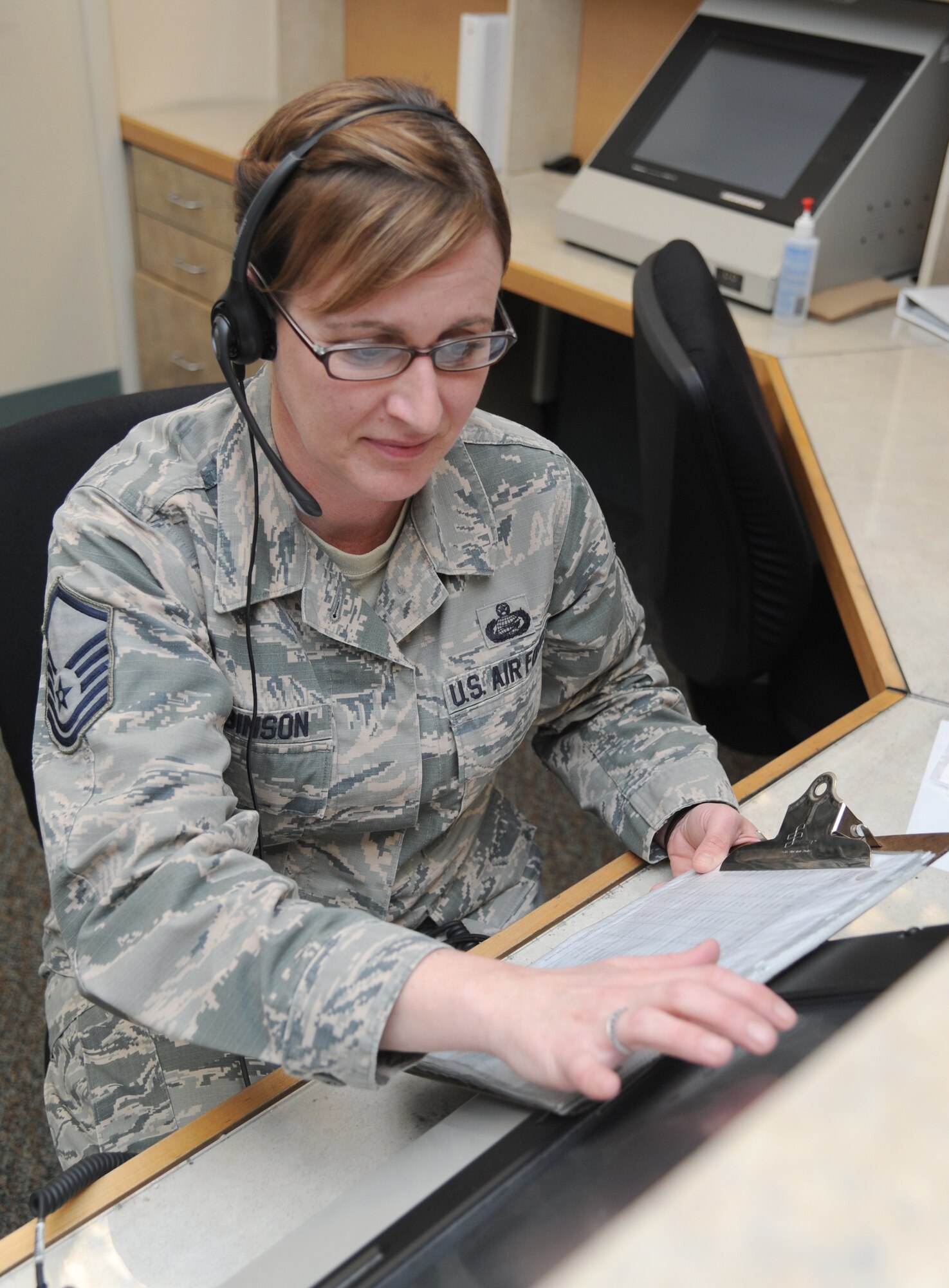 Master Sgt. Carla Robinson, 334th Training Squadron student, simulates coordinating mission requirements during the aviation resource management apprentice course March 16, 2015, at Cody Hall, Keesler Air Force Base, Miss.  Robinson graduates with perfect scores March 17, and will return to the 307th Fighter Squadron, Seymour Johnson Air Force Base, N.C.  (U.S. Air Force photo by Kemberly Groue)
