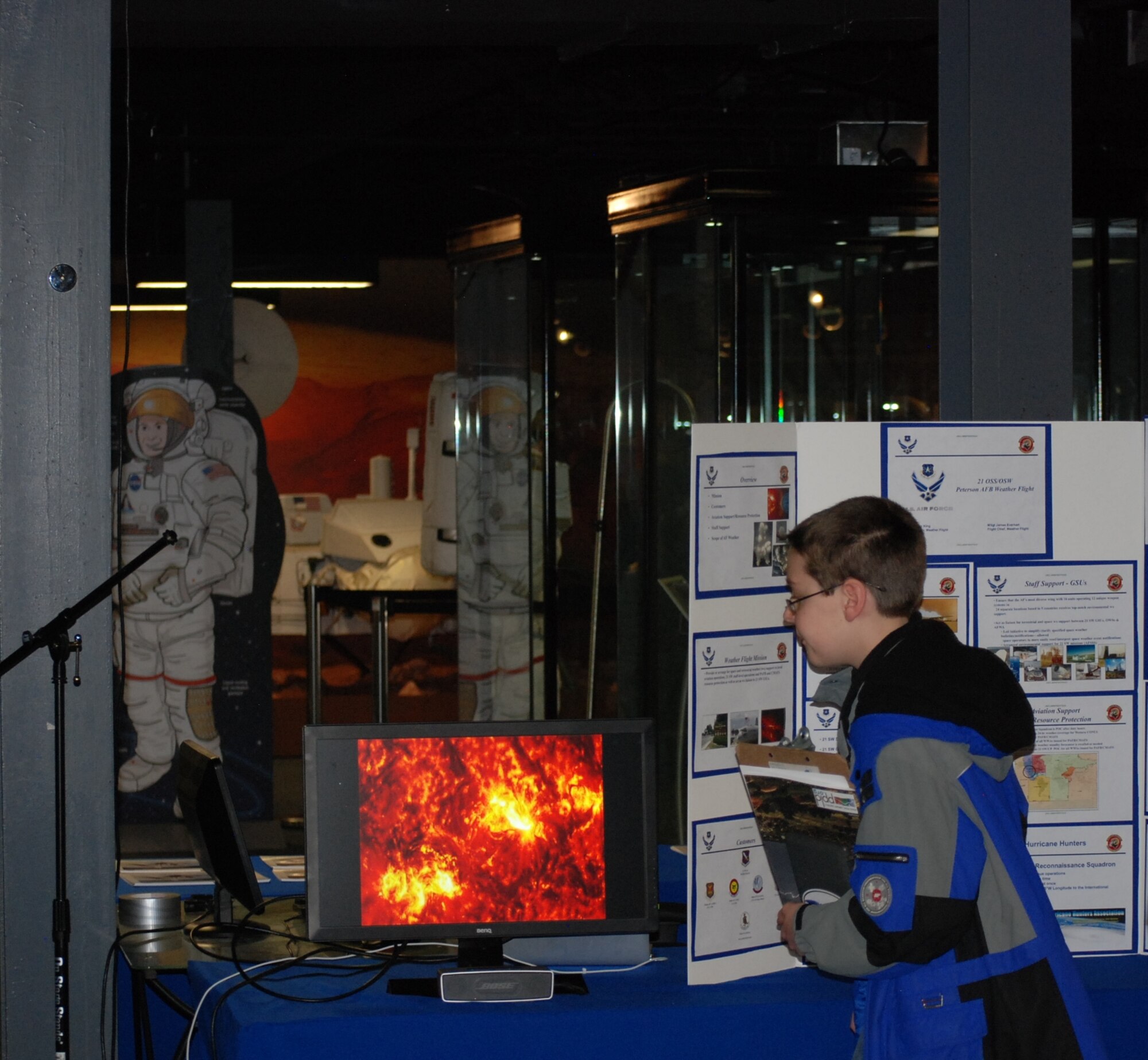 COLORADO SPRINGS, Colo. -- Space Foundation Star Days visitor Zachary Miller, 11, of Monument, Colo., views a video about space weather at the 21st Operations Support Squadron Weather Flight display March 7. Zachary loves weather, according to his father Steve Miller, and wants to become a storm chaser. (U.S. Air Force photo by Dave Smith)