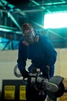 An Airman from the 5th Maintenance Squadron repair and reclamation section uses an electric saw to cut the vertical fin of a B-52H Stratofortress on Minot Air Force Base, N.D., Feb. 25, 2015. The fin is being cut for shipping purposes for thermal and blast testing. Thermal testing will look at the thermal response of coatings and material stack-ups to a pulse similar to a nuclear thermal pulse. Blast testing will be conducted at a future date looking into the structural response to an overpressure shockwave. The results will be used to update the nuclear hardness of the aircraft, which is used in models to produce Escape Distance Required Curves within Technical Order 25s. (U.S. Air Force photo/Senior Airman Brittany Y. Bateman)