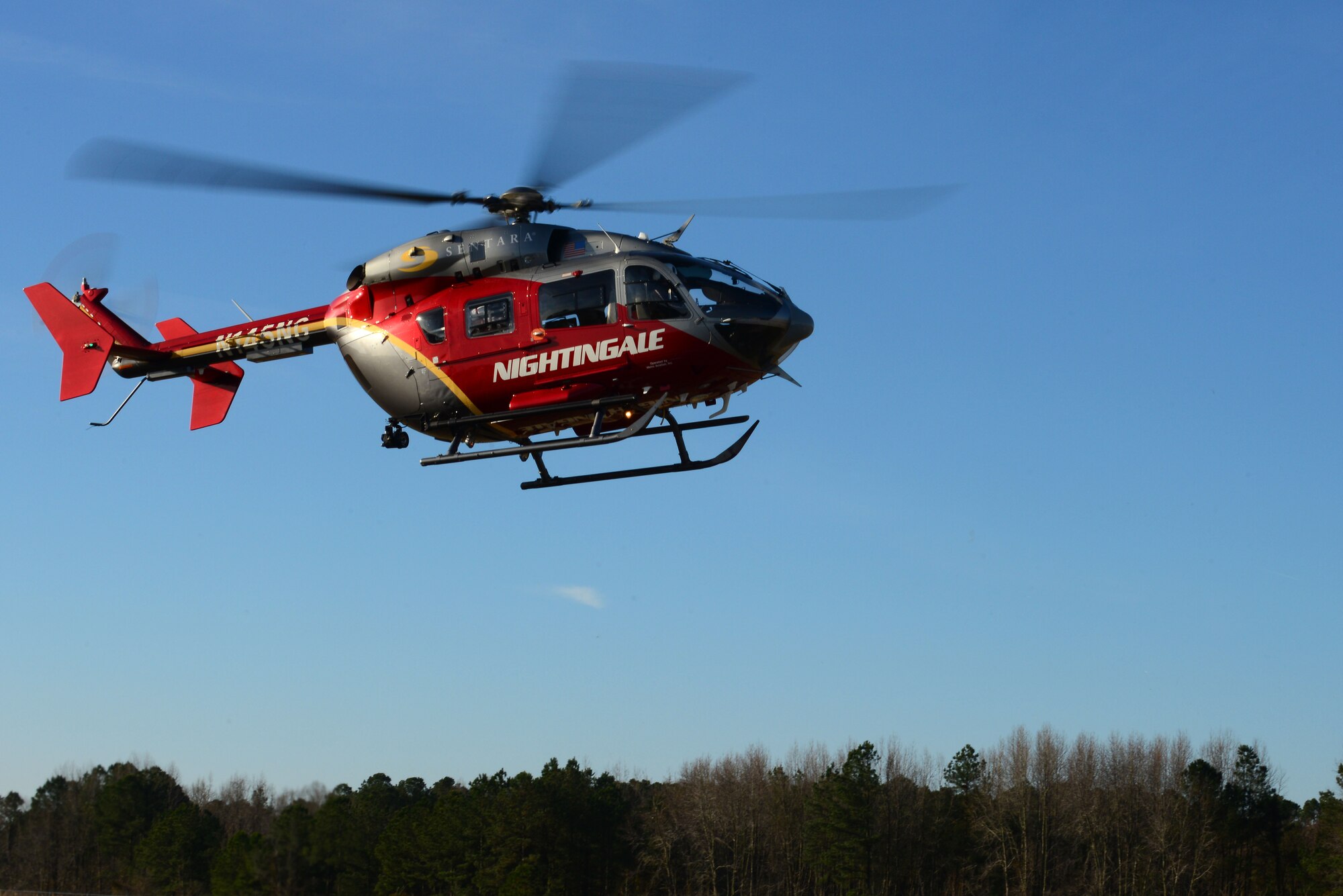 A medical helicopter from Sentara Norfolk General Hospital took part in a full-scale helicopter crash exercise at Fort Eustis, Va., March 13, 2015. The helicopter took one of the simulated critically injured members to a nearby hospital. (U.S. Air Force photo by Senior Airman Kimberly Nagle/Released)