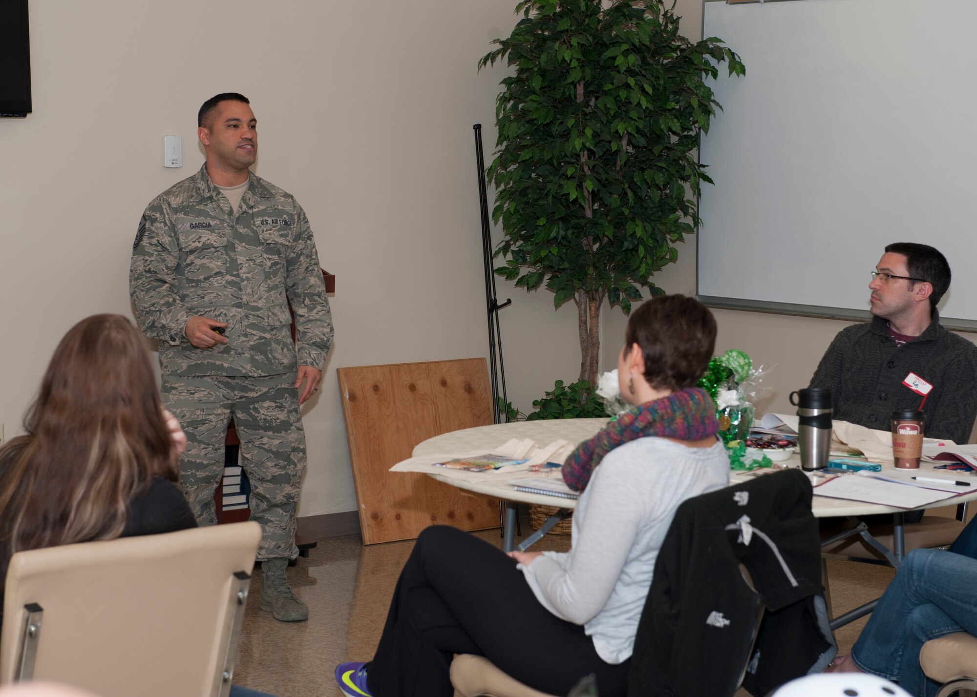 Master Sgt. William Garcia, 436th Aircraft Maintenance Squadron first sergeant, speaks to a group of spouses on the roles that first sergeants serve within squadrons at the Heartlink Spouse Orientation Program March 12, 2015, at Dover Air Force Base, Del. This event helps spouses who are new to Dover AFB, better orient themselves to the military lifestyle. (U.S. Air Force photo/Airman 1st Class Zachary Cacicia)