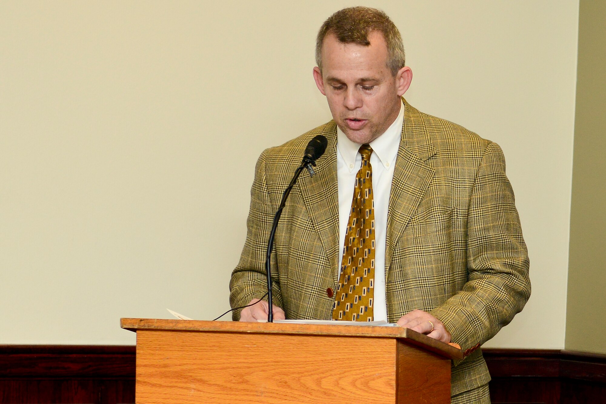 Mark Sowers, Survivor Outreach Services financial counselor, speaks during an unveiling ceremony for the Wall of Remembrance at Fort Eustis, Va., March 13, 2015. The wall was erected to honor fallen Service members and their families, by hanging pictures for all to see. (U.S. Air Force Senior Airman Kimberly Nagle/Released)

