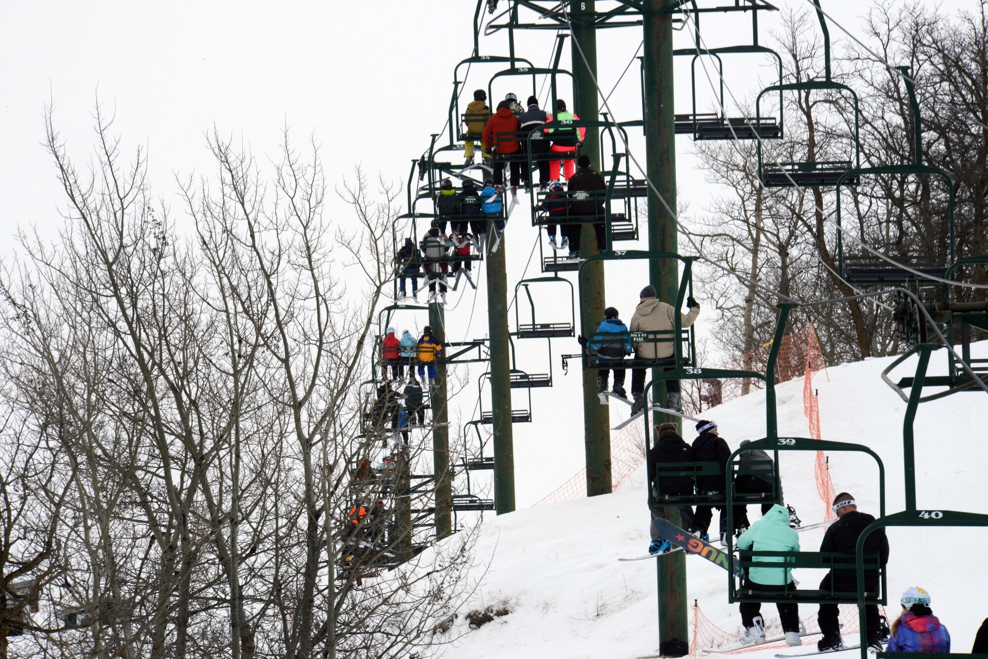 Airmen and their families from Minot Air Force Base, N.D., ride the ski lift during military appreciation day at Bottineau Winter Park, March 7, 2015. More than 170 Airmen and families were admitted into the park for free. (U.S. Air Force photo/Senior Airman Brittany Y. Bateman)
