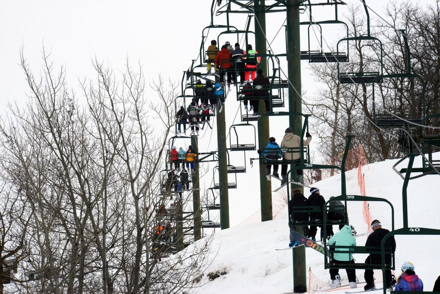 Airmen and their families from Minot Air Force Base, N.D., ride the ski lift during military appreciation day at Bottineau Winter Park, March 7, 2015. More than 170 Airmen and families were admitted into the park for free. (U.S. Air Force photo/Senior Airman Brittany Y. Bateman)