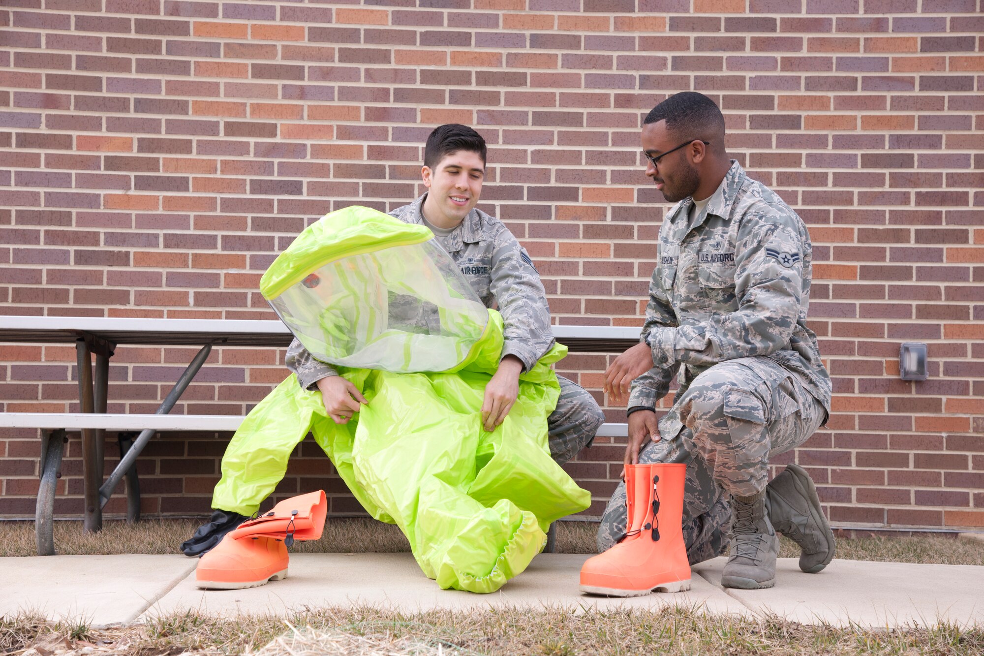 Senior Airman Thomas Hollingsworth, 779th Aerospace Medicine Squadron bioenvironmental technician, checks the condition of a Level A hazardous material suit, with the help of Airman 1st Class Ashton McLaughlin, 779th AMS bioenvironmental technician, March 16, 2015, on Joint Base Andrews, Md. (U.S. Air Force photo/Senior Airman Mariah Haddenham)