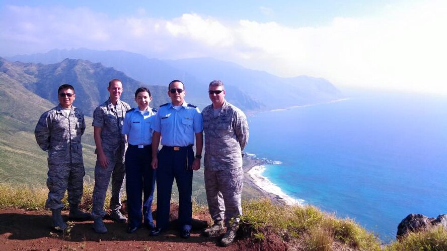 Participants of the Subject Matter Expert Exchange pose for a photo during their 21st Space Operations Squadron visit in February at Waianae, Hawaii. (Courtesy photo)